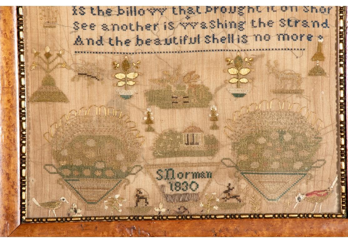 By S. Norman. With a now brown toned background and overall embroidery with birds, trees, flower baskets and architecture. With an English newspaper on the back. 
sight 14 3/4 x 12