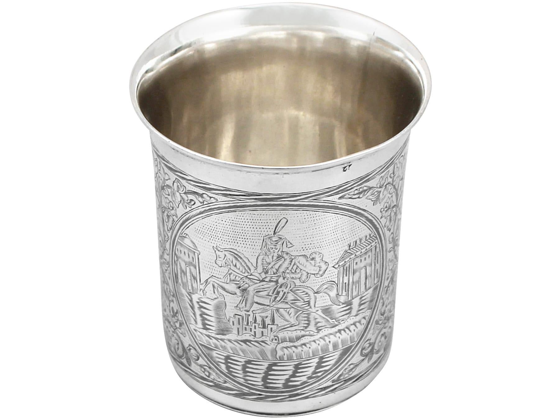 An exceptional, fine and impressive antique Russian niello enamel and silver beaker; an addition to our range of drinks related silverware.

This antique Russian silver beaker has a tapering cylindrical form with a flared rim.

The body of this