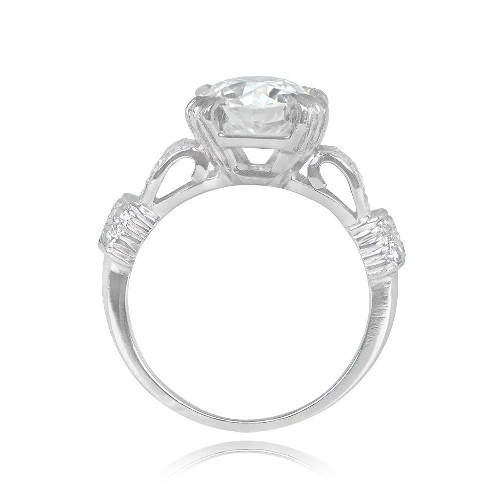 This Art Deco engagement ring showcases a 1.83-carat old European cut diamond in prong setting. Its I color and SI1 clarity emphasize its brilliance. The ring's unique design features curved shoulders adorned with horizontal and vertical rows of