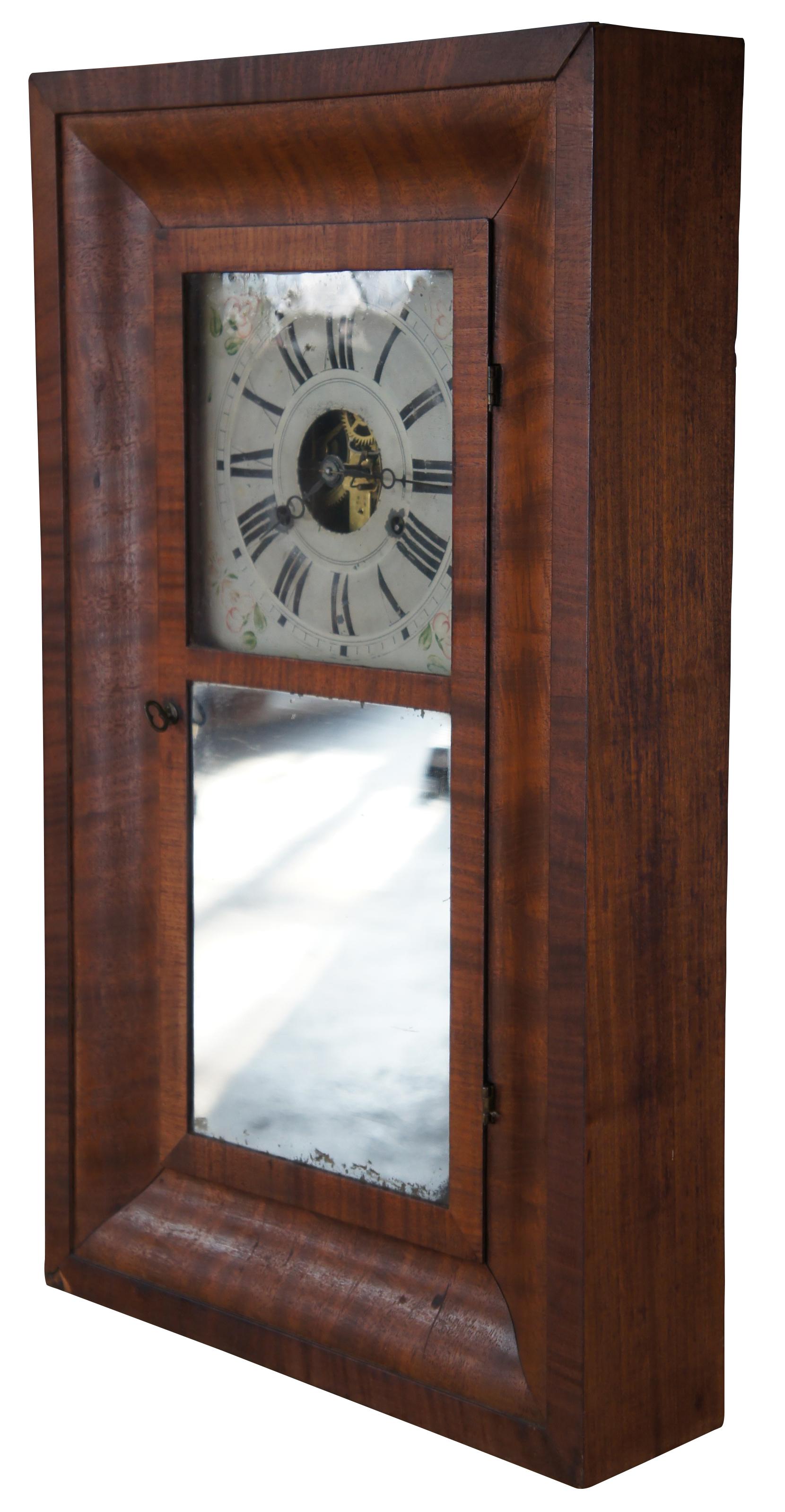 Antique mid-19th century Manross Prichard & Co 8 day shelf clock featuring Ogee (OG) form with mahogany case, brass works, roman numeral face and mirror. Circa 1843.

Manross, Prichard & Co, circa 1841-43. Elisha Manross bought a shop from Joseph