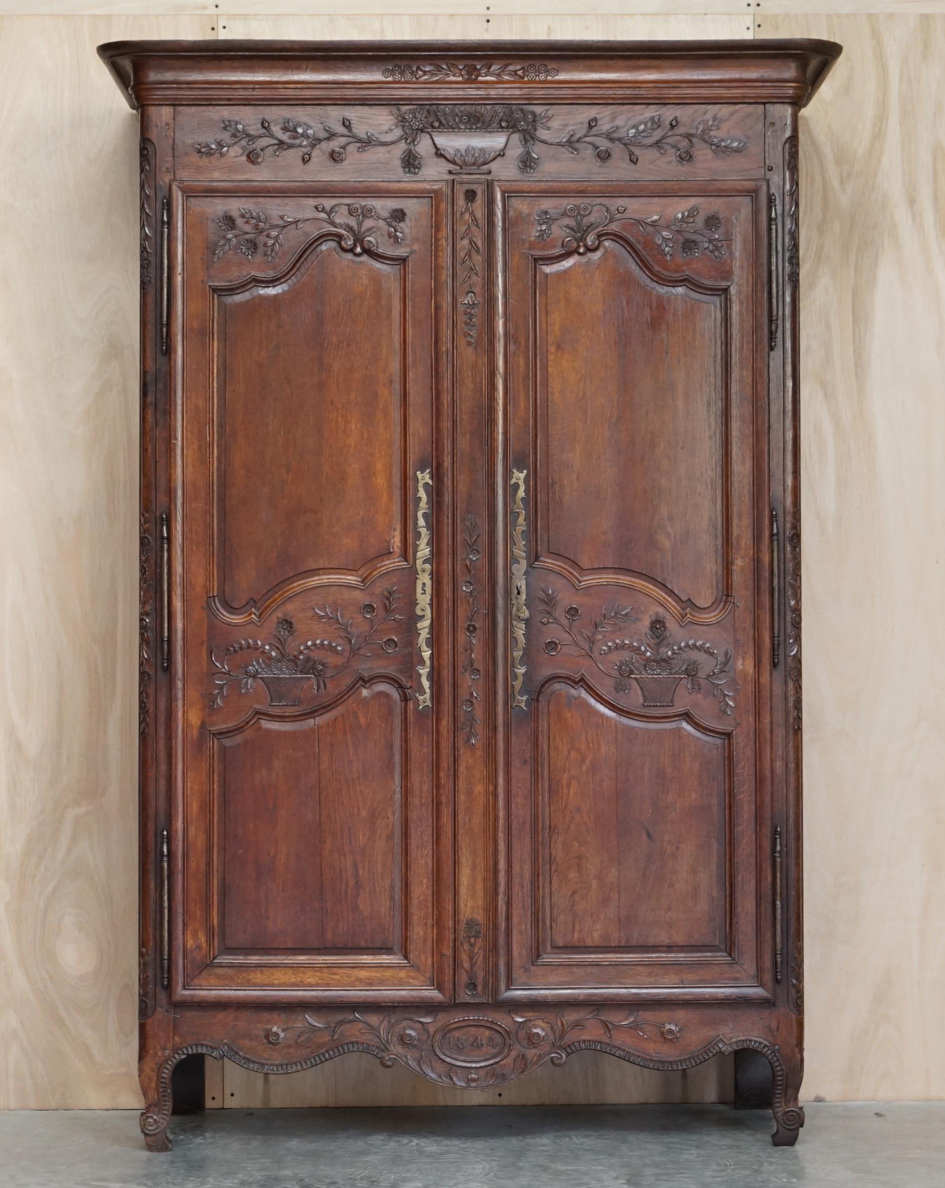 We are delighted to offer for sale this very grand, hand carved extremely large continental oak wardrobe dated to the base 1844

A truly stunning piece, this is a tour de force of carving, its all oak with solid brass fittings and the original