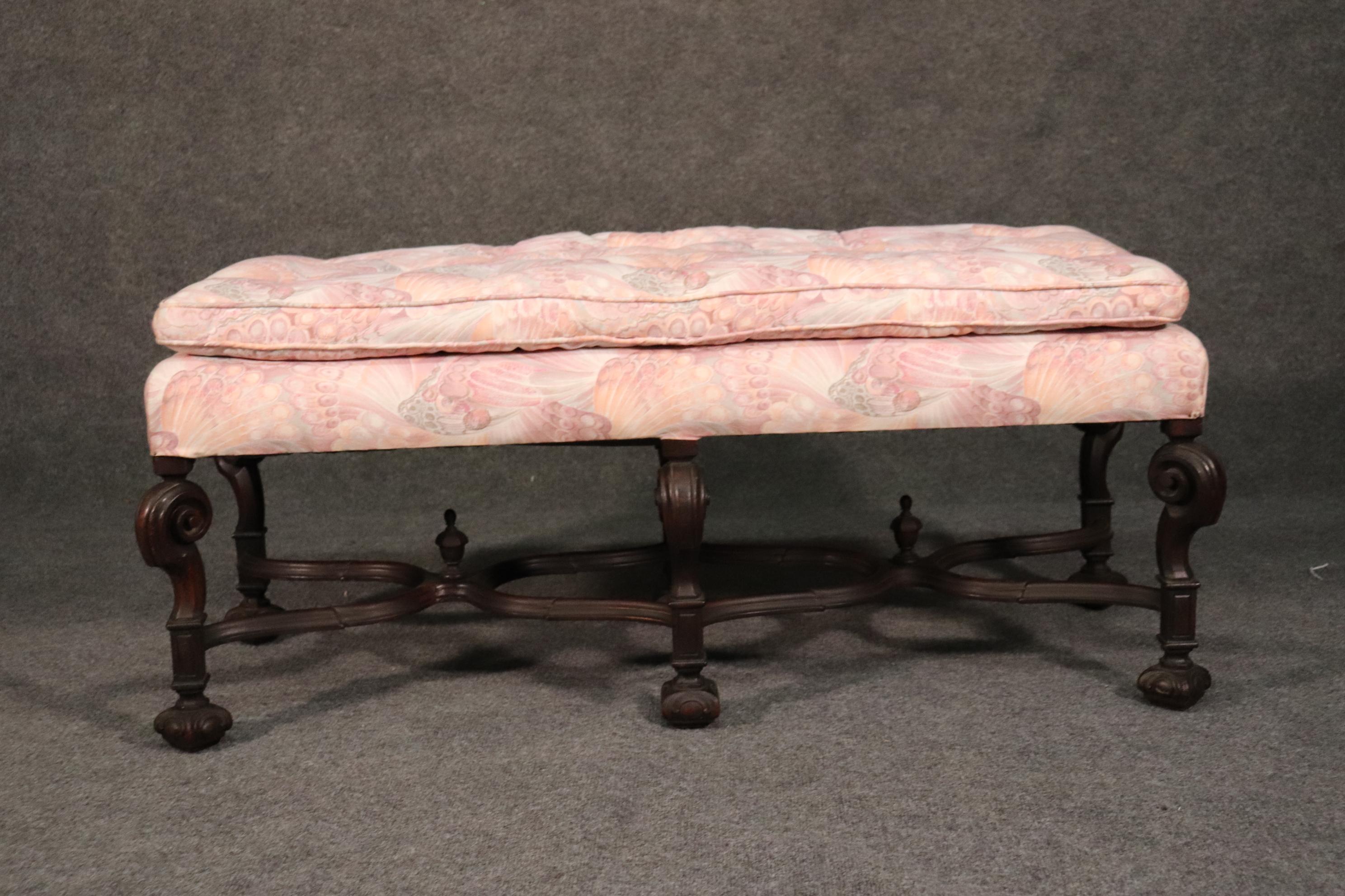 This is a rare Wlliam and Mary style English walnut bench. The frame has old stable repairs from many years ago. The upholstery is in good condition but will show signs of age and possible slight stains from use. The bench measures 47 wide x 20 tall