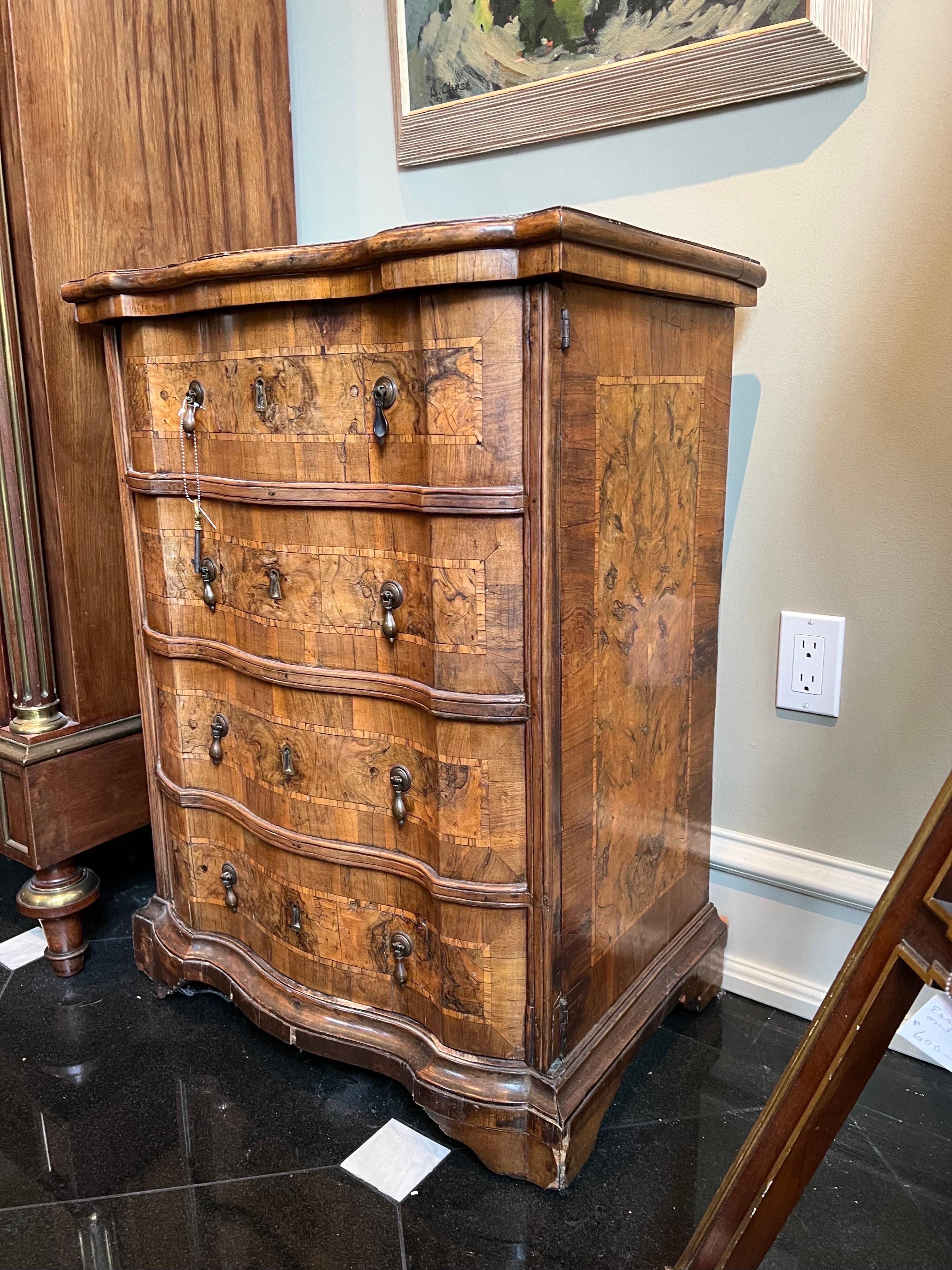 This is a fabulous antique Baroque set, made in Italy, circa 1750s. It has been made from The finest burl walnut with walnut crossbanding and bowwood inlaid lines. One table has dovetailed drawers and other include shelves. It has its original