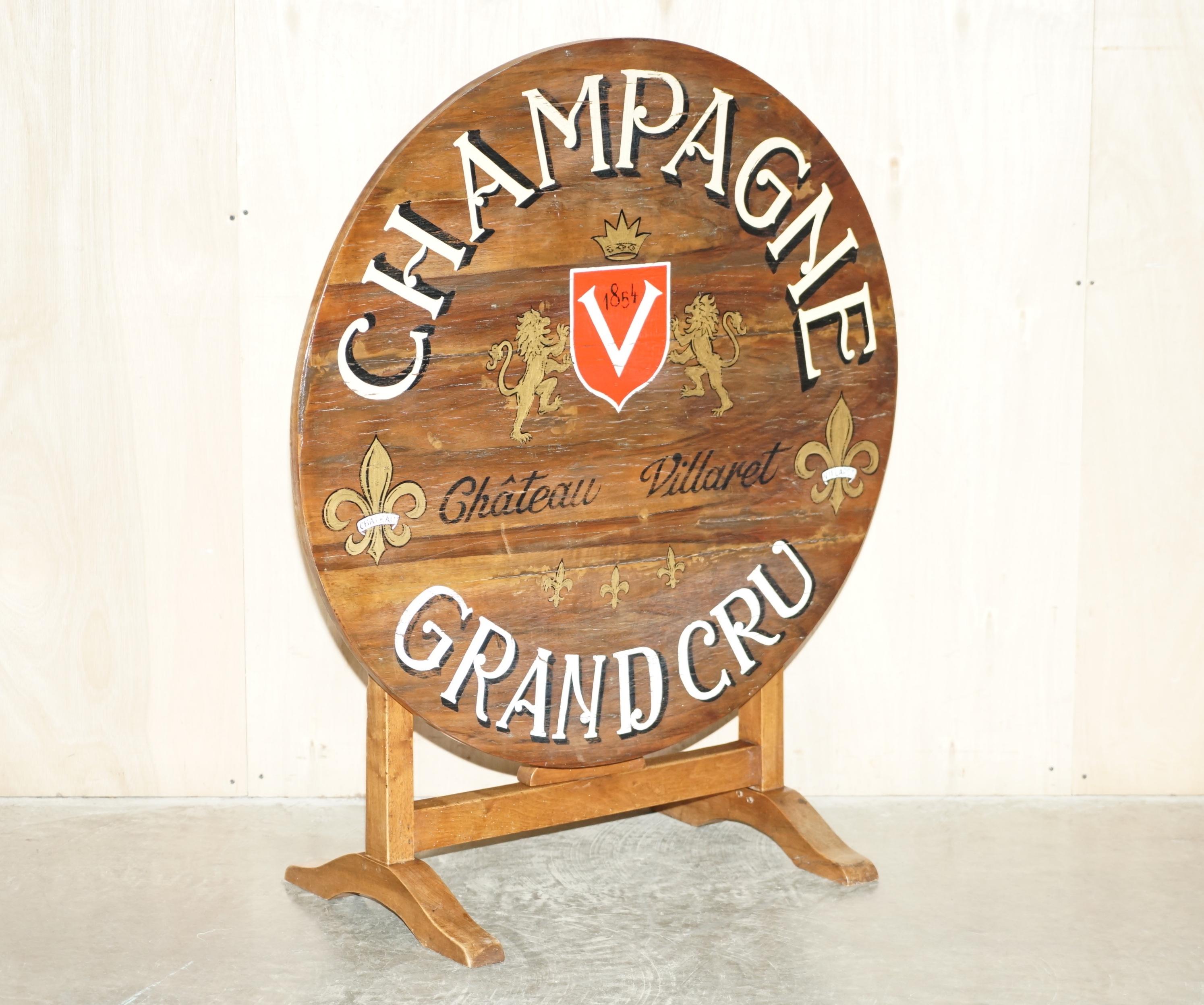 We are delighted to offer for sale this absolutely exquisite original circa 1854 dated Vendange Wine tasting, tilt top table in Fruitwood with hand painted Armorial crest / coat of Arms to the top

A very well made and extremely decorative table.