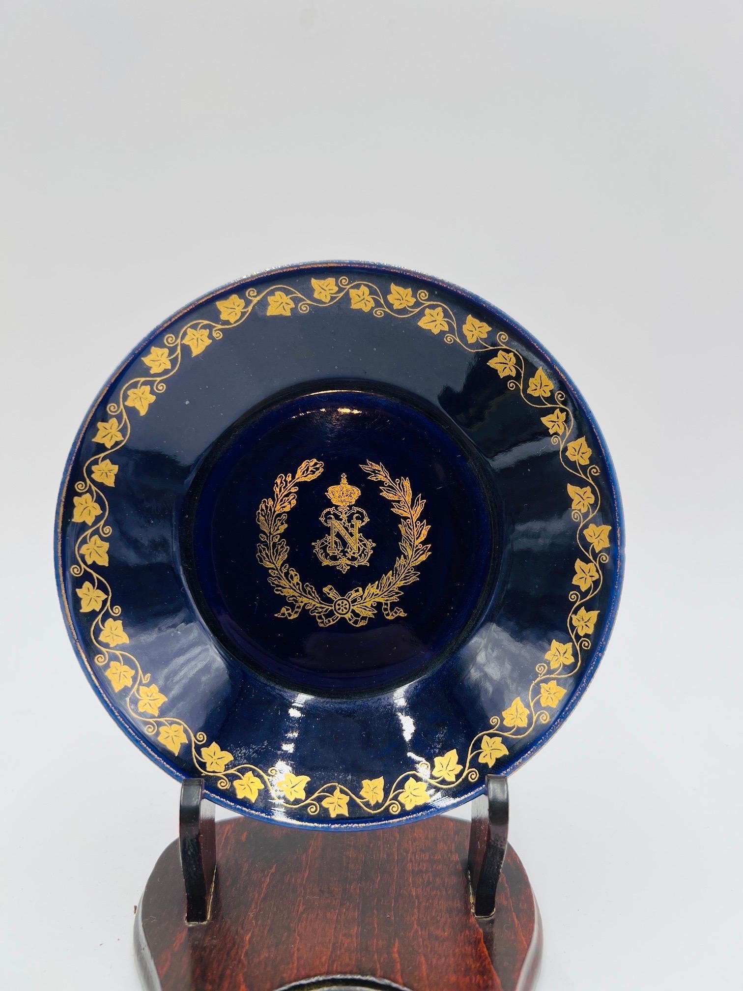 Antique 1857 Sevres Napoleon III Cobalt “N” Crowned Cup/Saucer. 
The cup & saucer is decorated with the Napoleon III service crowned “N” to each piece with a cobalt ground and gilt border. Marked to underside appropriately.