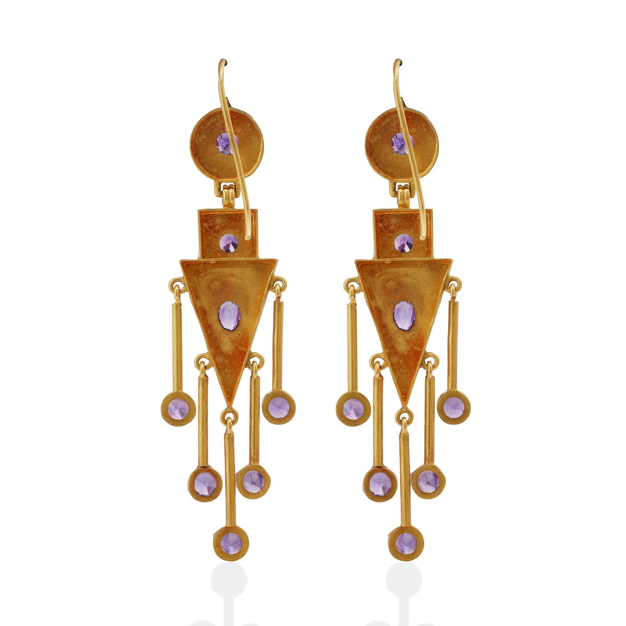 Created circa the 1860s, these antique 18K gold Italian fringe pendant earrings are set with amethysts. The flexible pendant earrings in the archaeological style are designed as circular tops suspending rectangular and triangular shaped plaques