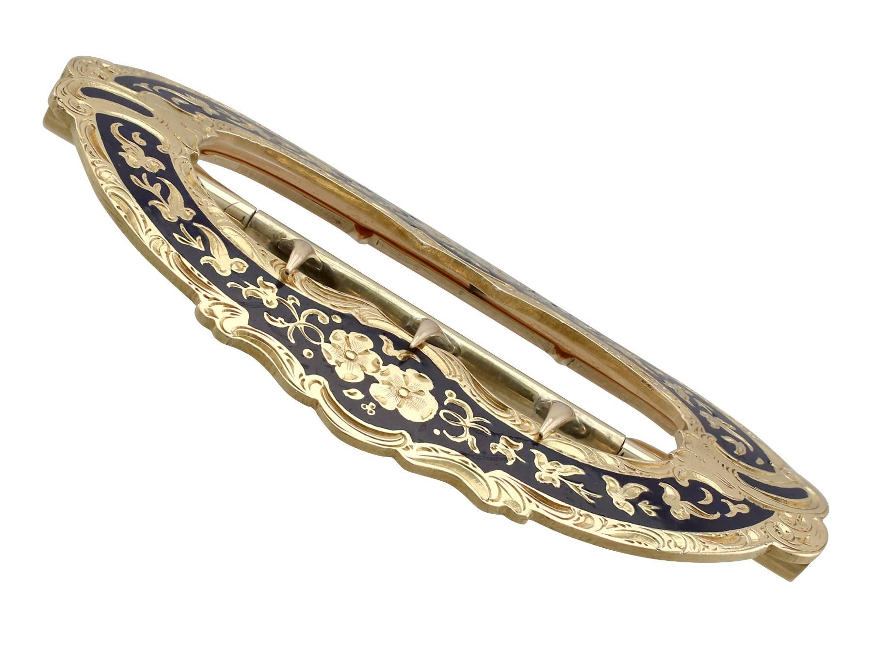 An impressive antique Victorian blue enamel and 15 karat yellow gold belt buckle; part of our diverse antique jewelry and estate jewelry collections.

This fine and impressive antique belt buckle has been crafted in 15k yellow gold.

The oval shaped