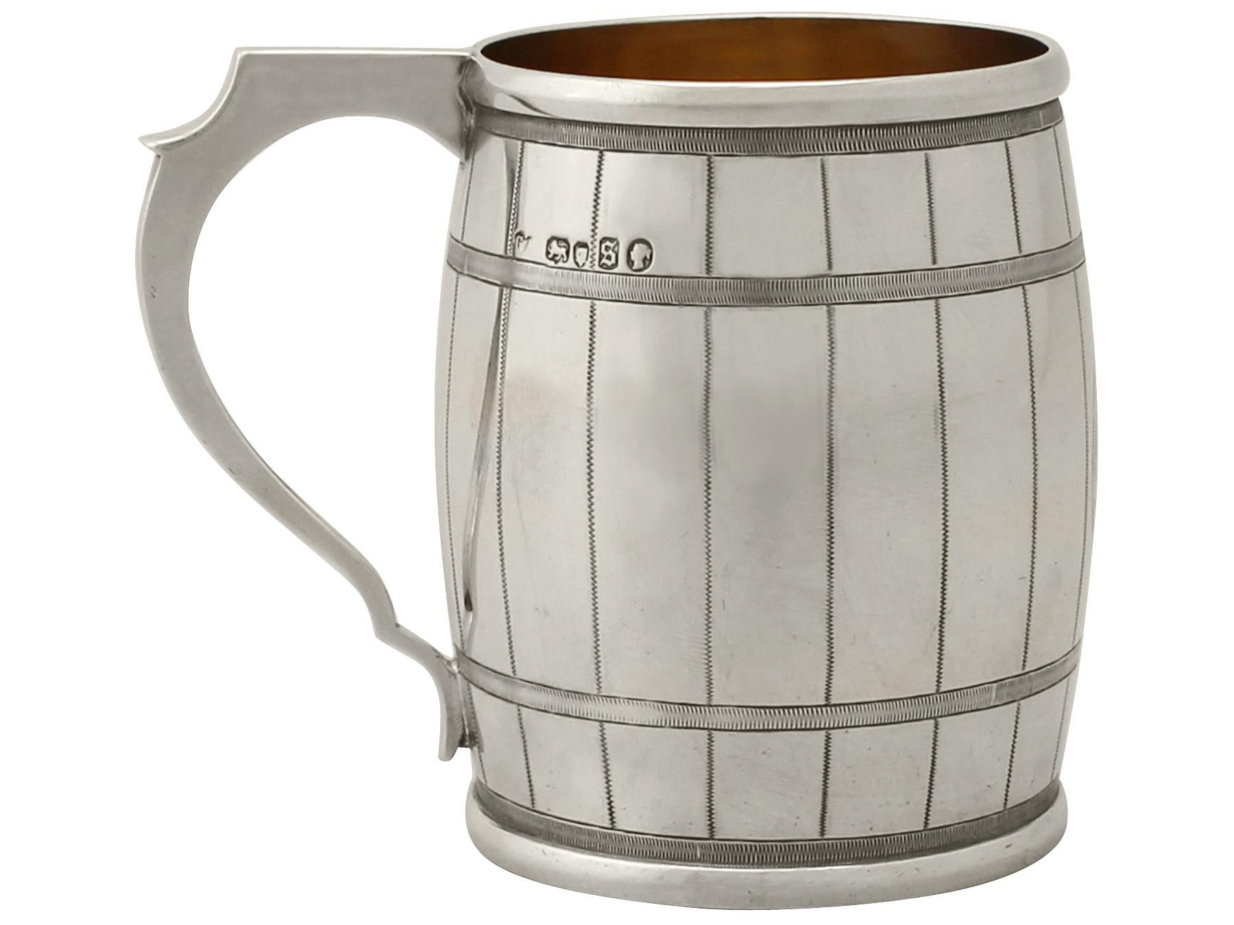An exceptional, fine and impressive antique Victorian English sterling silver christening mug in the form of a barrel, made by George Adams; an addition to our silver christening gifts collection

This exceptional antique Victorian sterling silver