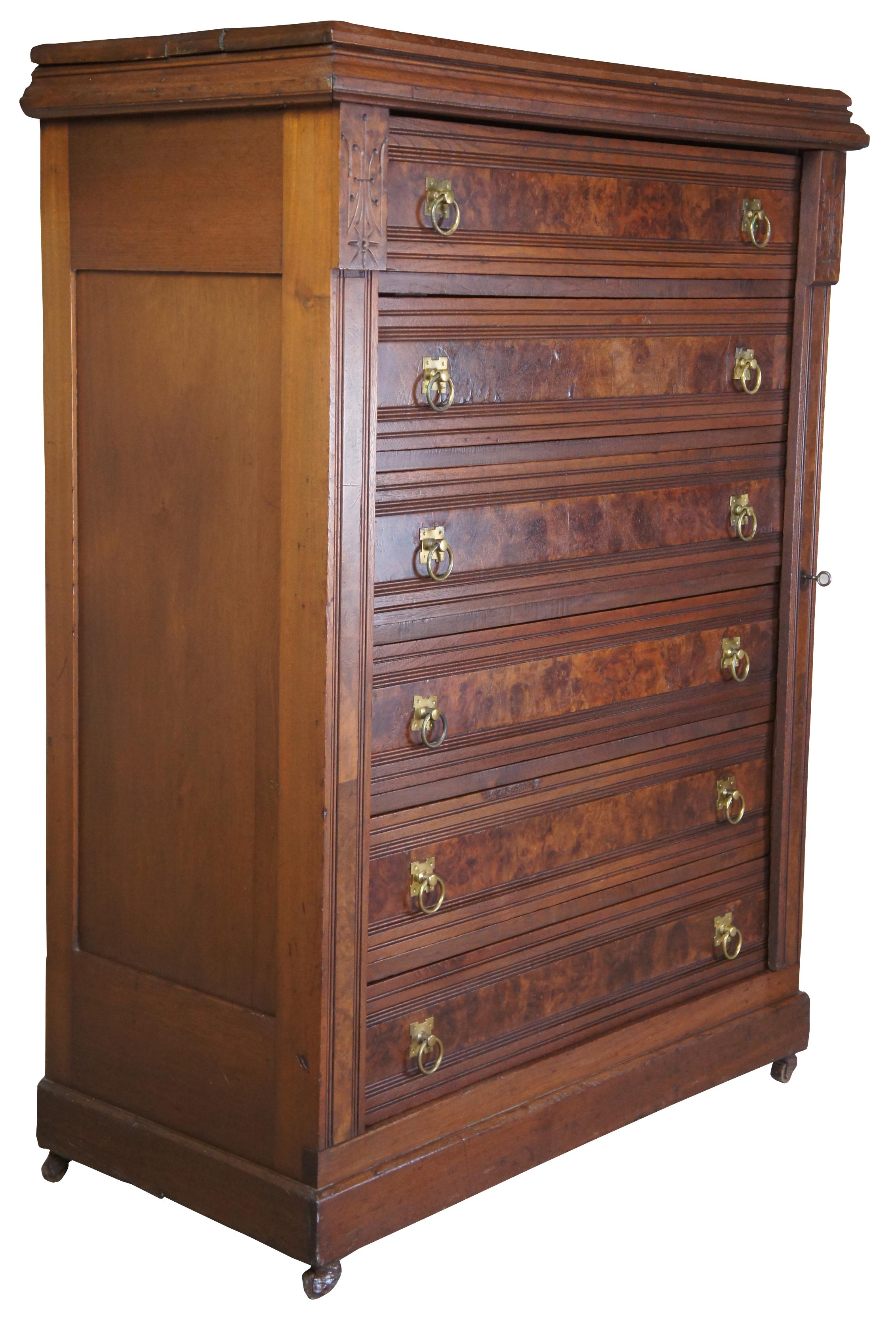 Antique Eastlake side lock chest of drawers, circa 1870s. Made of walnut with burled drawer fronts featuring a side lock panel, six drawers and brass knocker pulls.
 