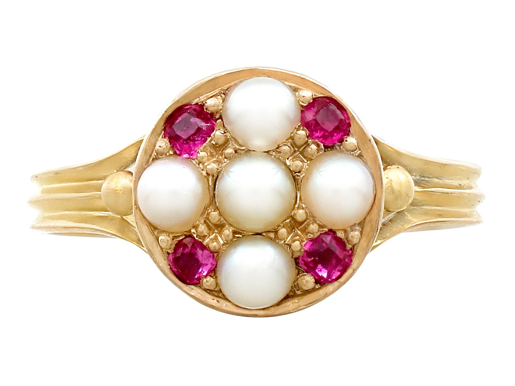 A fine and impressive Victorian natural pearl and 0.16 carat natural ruby, 18 karat yellow gold dress ring; part of our diverse antique jewelry and estate jewelry collections

This fine and impressive antique ruby and pearl ring has been crafted in