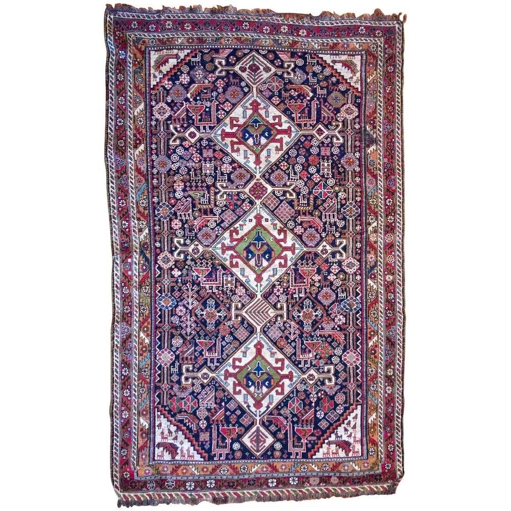 Antique Persian 1880-1890 Qashqai Rug. This exquisite rug is a testament to the artistry and skill of the Qashqai weavers from the late 19th century.

Crafted with the utmost care and precision, this Persian Qashqai rug features a handspun wool warp