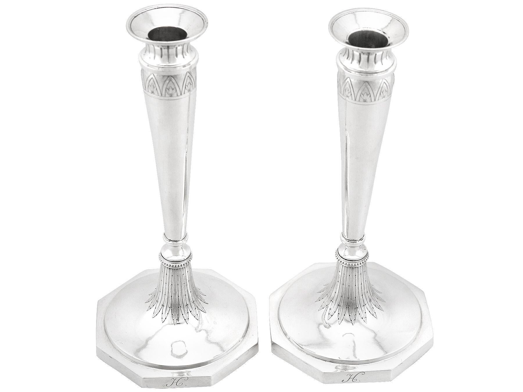 An exceptional, fine and impressive pair of antique European silver candlesticks; an addition to our continental silverware collection.

These exceptional antique European silver candlesticks have a circular rounded form to a hexagonal shaped