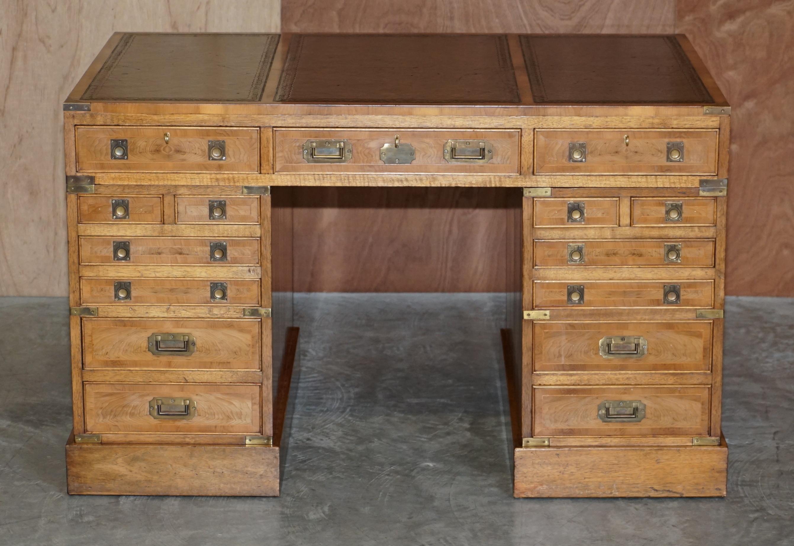 We are delighted to offer this very rare and highly collectable, double sided, original Military Campaign partner desk in Burr Elm with hand dyed leather top

Please note the delivery fee listed is just a guide, it covers within the M25 only for