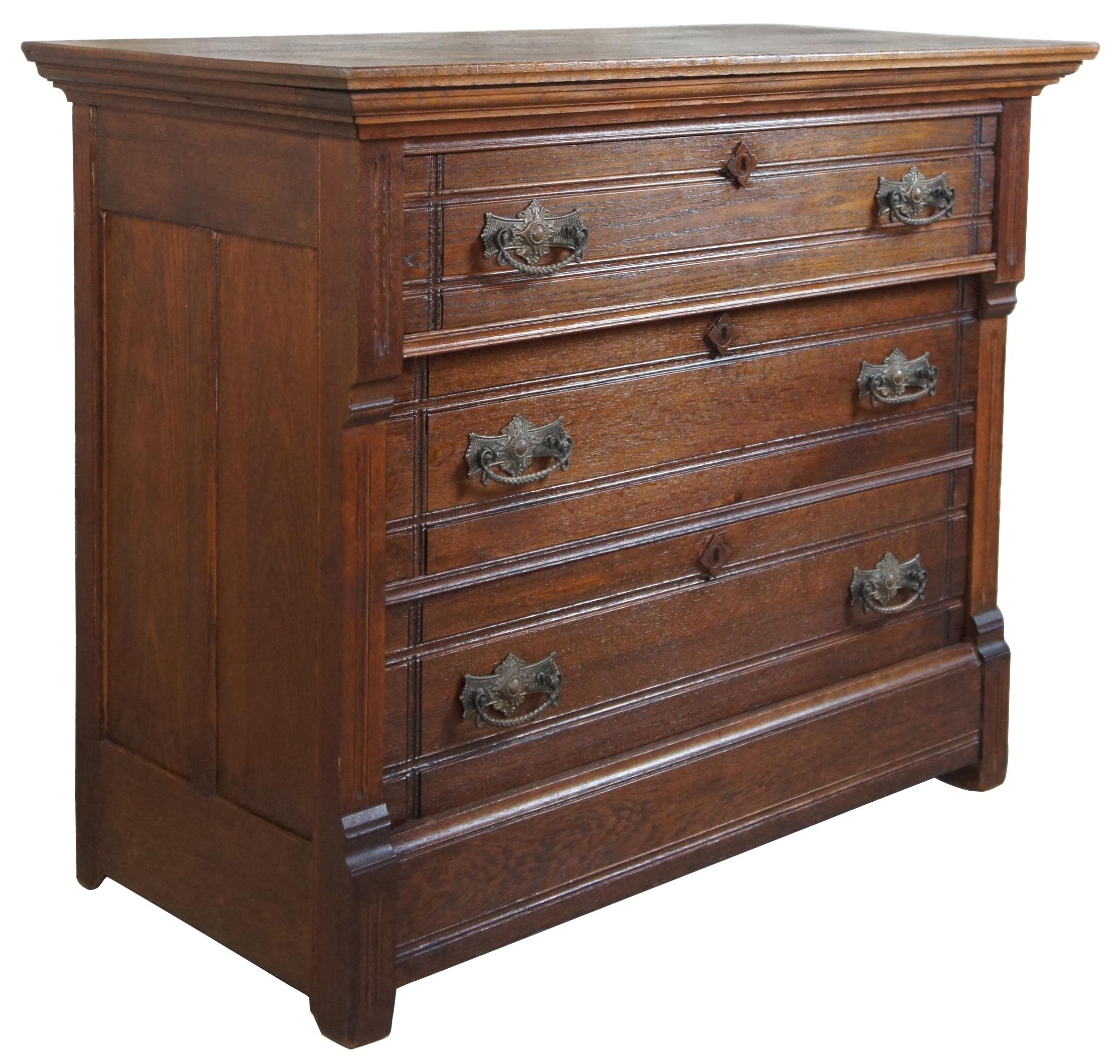 Aesthetic period three drawer dresser, circa 1880s. Made from oak with ornate brass hardware. The drawers are constructed using the Knapp Joint. The Knapp joint was developed during the late Victoria Era in post-Civil War United States. It was
