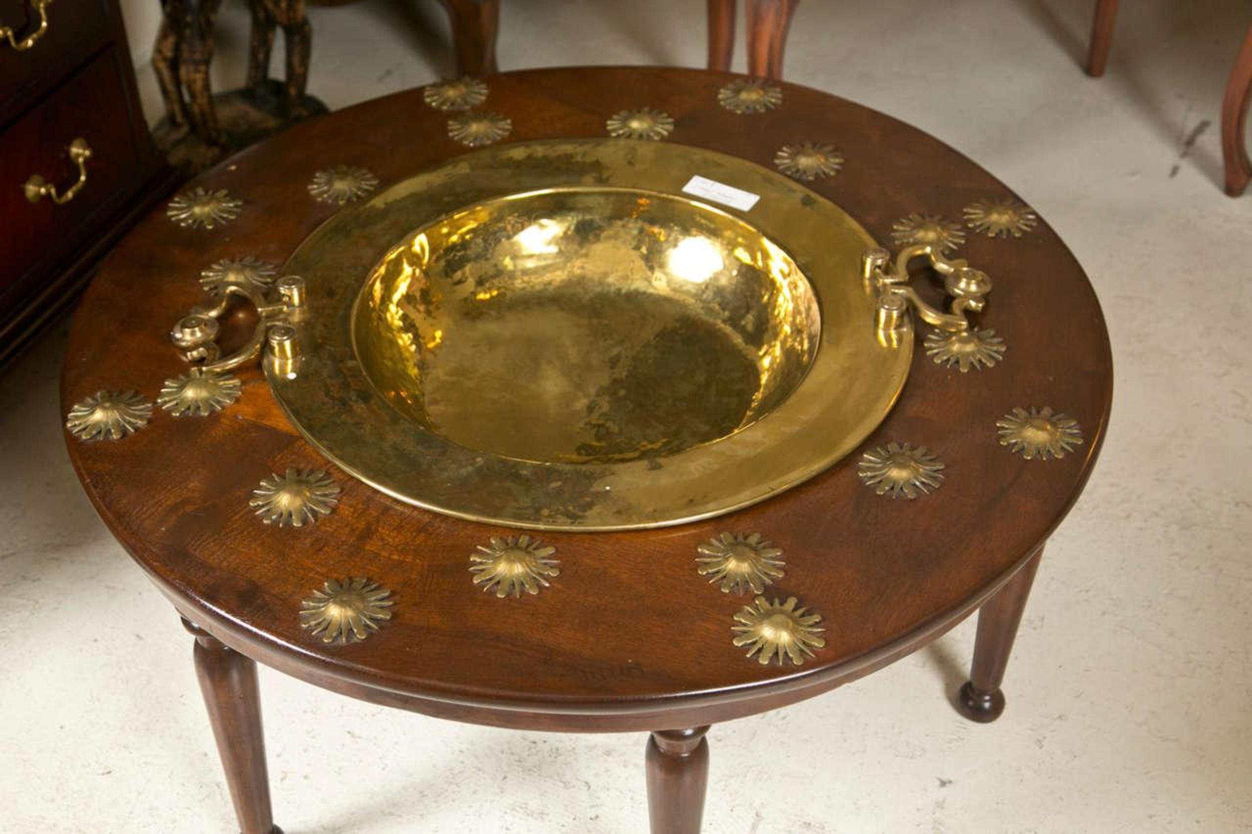 Fine late 19th century Empire style Brazier. The walnut wood tapering feet leading to a circular bronze mounted table top supporting a copper twin handled brazier.