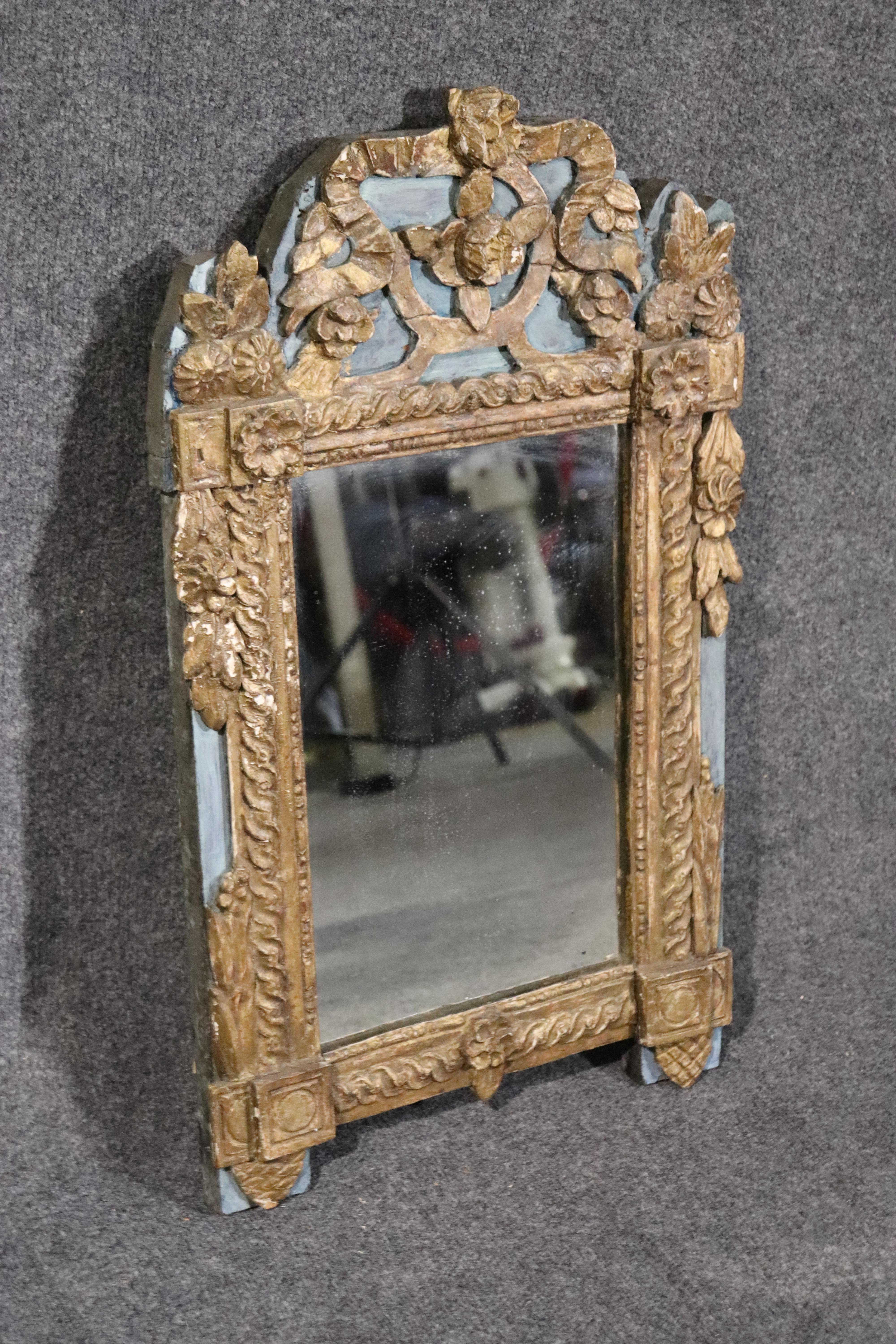 This is a beautiful gilded carved authentic Venetian mirror with blue paint and a great design. Measures 30 tall x 17.5 wide and will be a perfect addition to a bedroom or even a foyer.