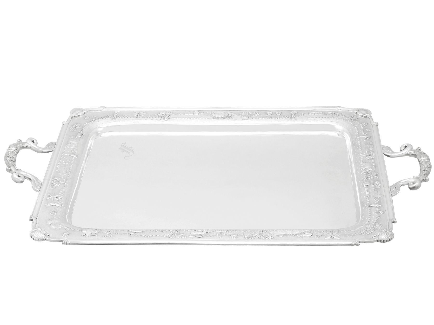 An exceptional, rare and impressive antique Indian silver two handled tea tray, an addition to our Asian silverware collection.

This exceptional antique Indian silver tray has a rectangular shaped form with rounded corners.

This two handled tea
