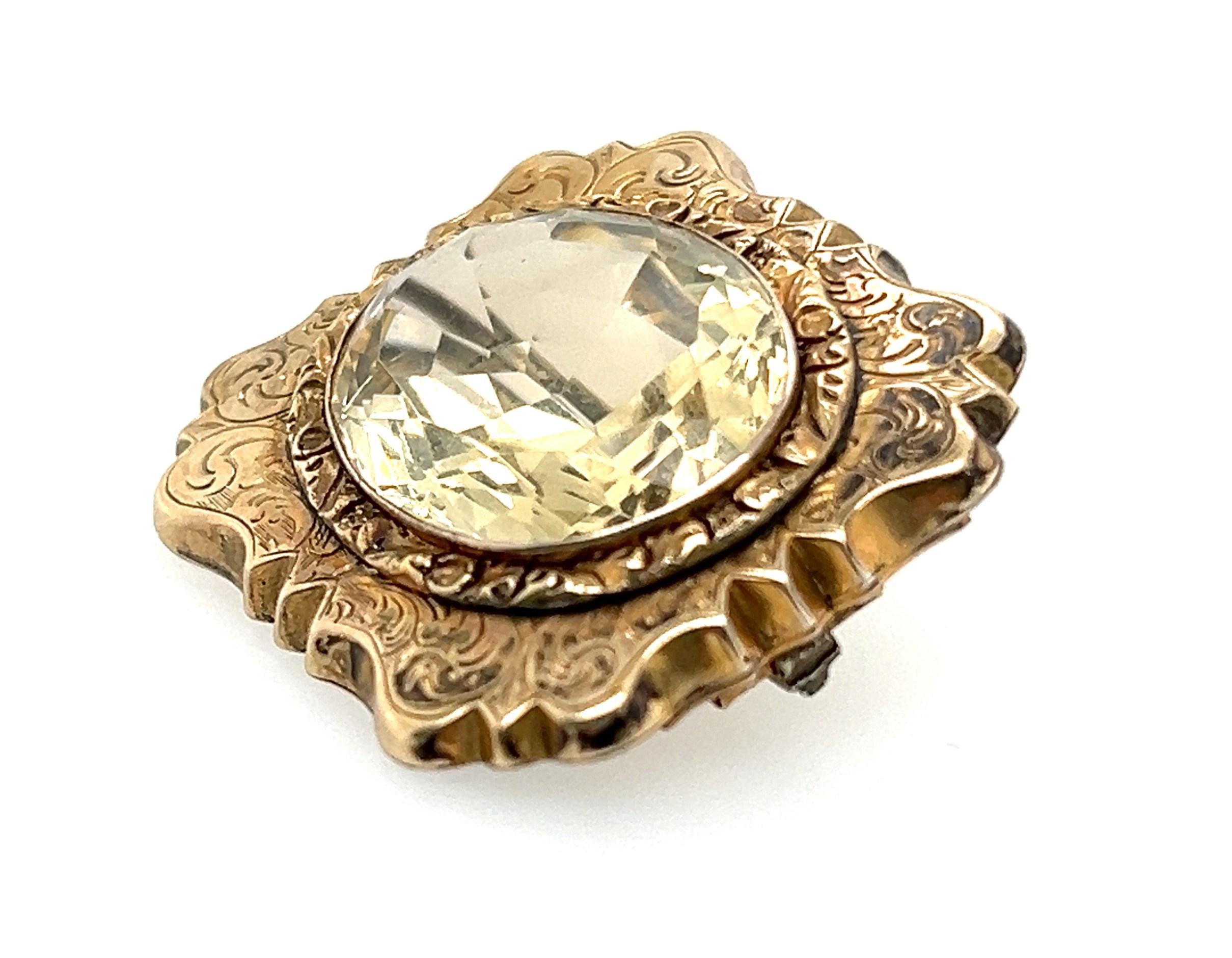 Fabulous Antique brooch with repoussé setting and scroll work in the 10kt yellow gold. This brooch was made around the last few decades of the 1800s, Circa 1880. There were two Gothic Revival styles in the 1800s and this is from the latter. It bears