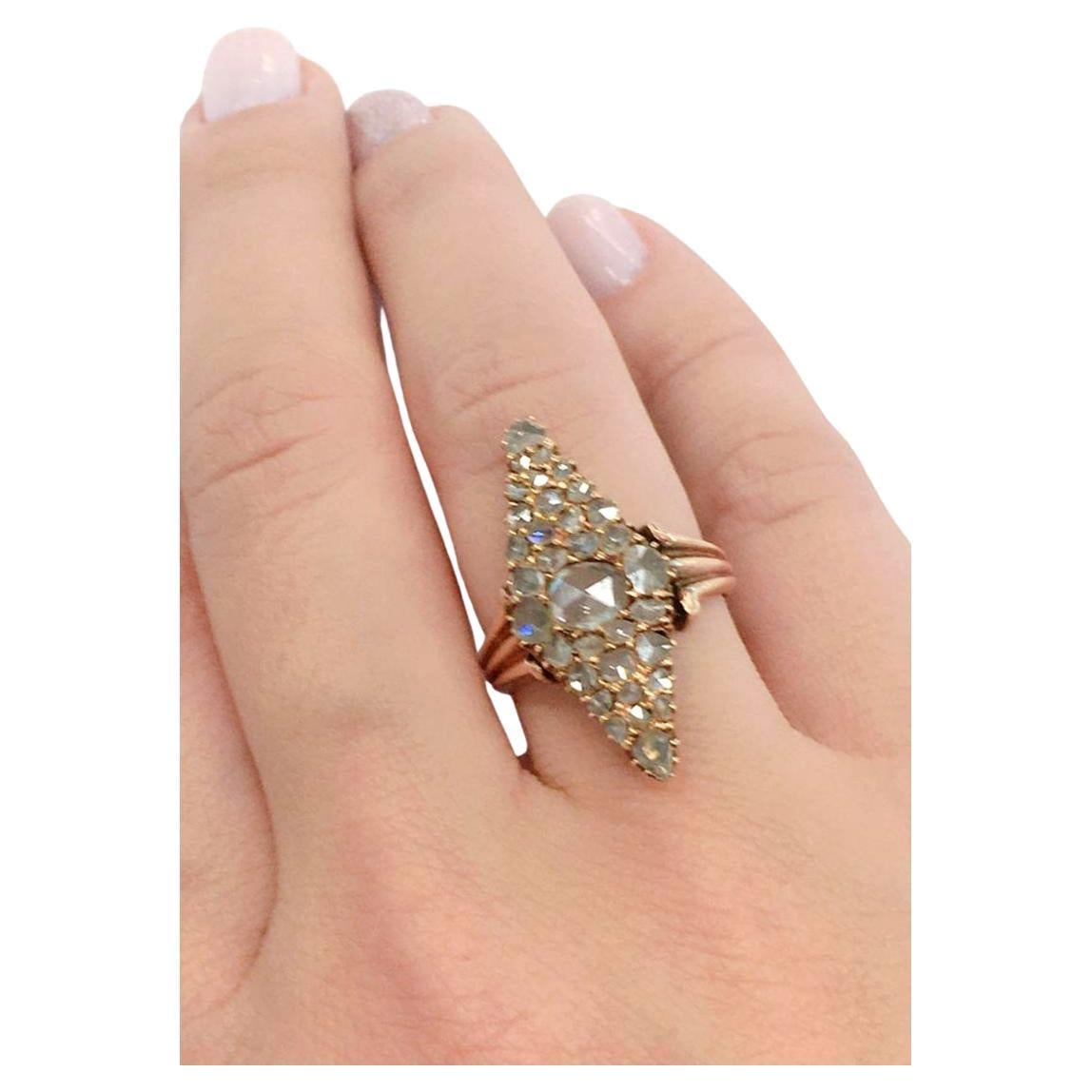 Antique imperial Russian era rose cut diamond ring in navette style with an estimate diamond weight of 3 carats unfoiled back hall marked 56 imperial Russian gold standard and Moscow assay mark st George slaying the dragon before 1900.c and initial