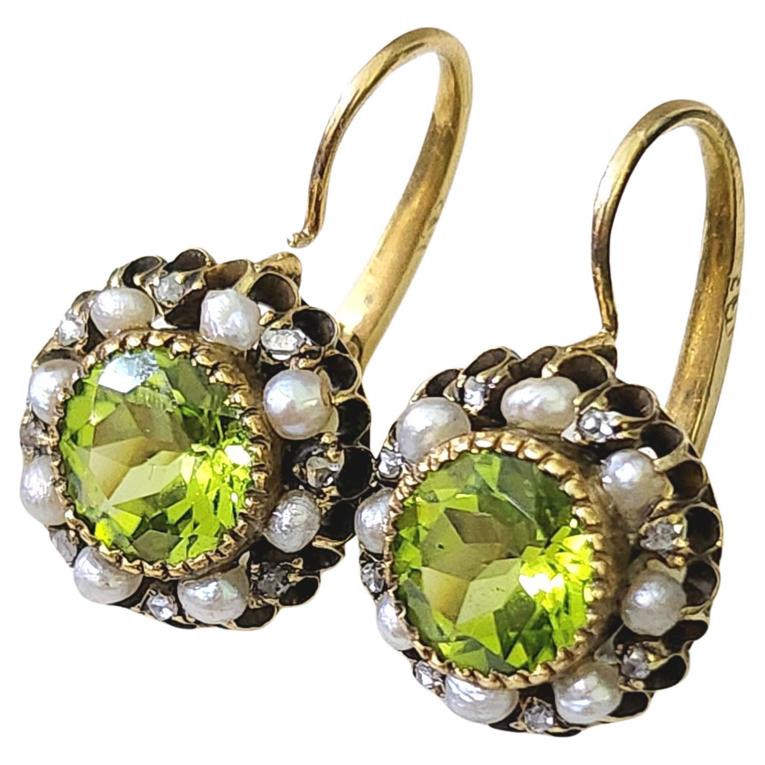 Antique rare find 2.40 carats peridot gold earrings made in moscow 1880s during the imperial russian era 14k gold earrings centered with green olive peridot 1.20 carats each excellent spark flanked with seed pearls earrings diameter 12mm and 2cm