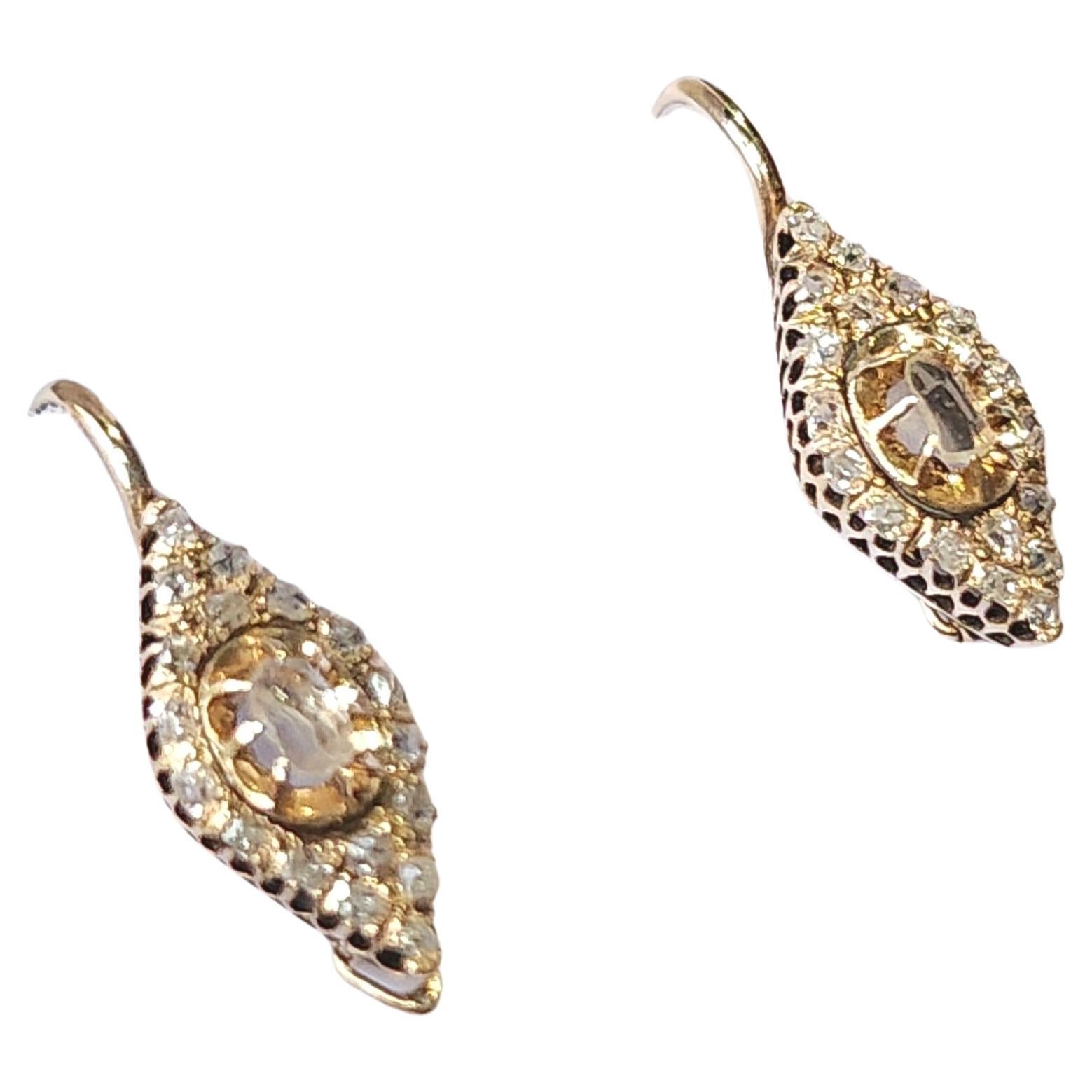 1880s impérial russian era unuswal 14k gold earrings in navit designe with rose cut diamonds estimated weight of 0.50ct earrings has safty locks 2cm lenght hall marked 56 imperial gold standard initial maker mark and assay mark