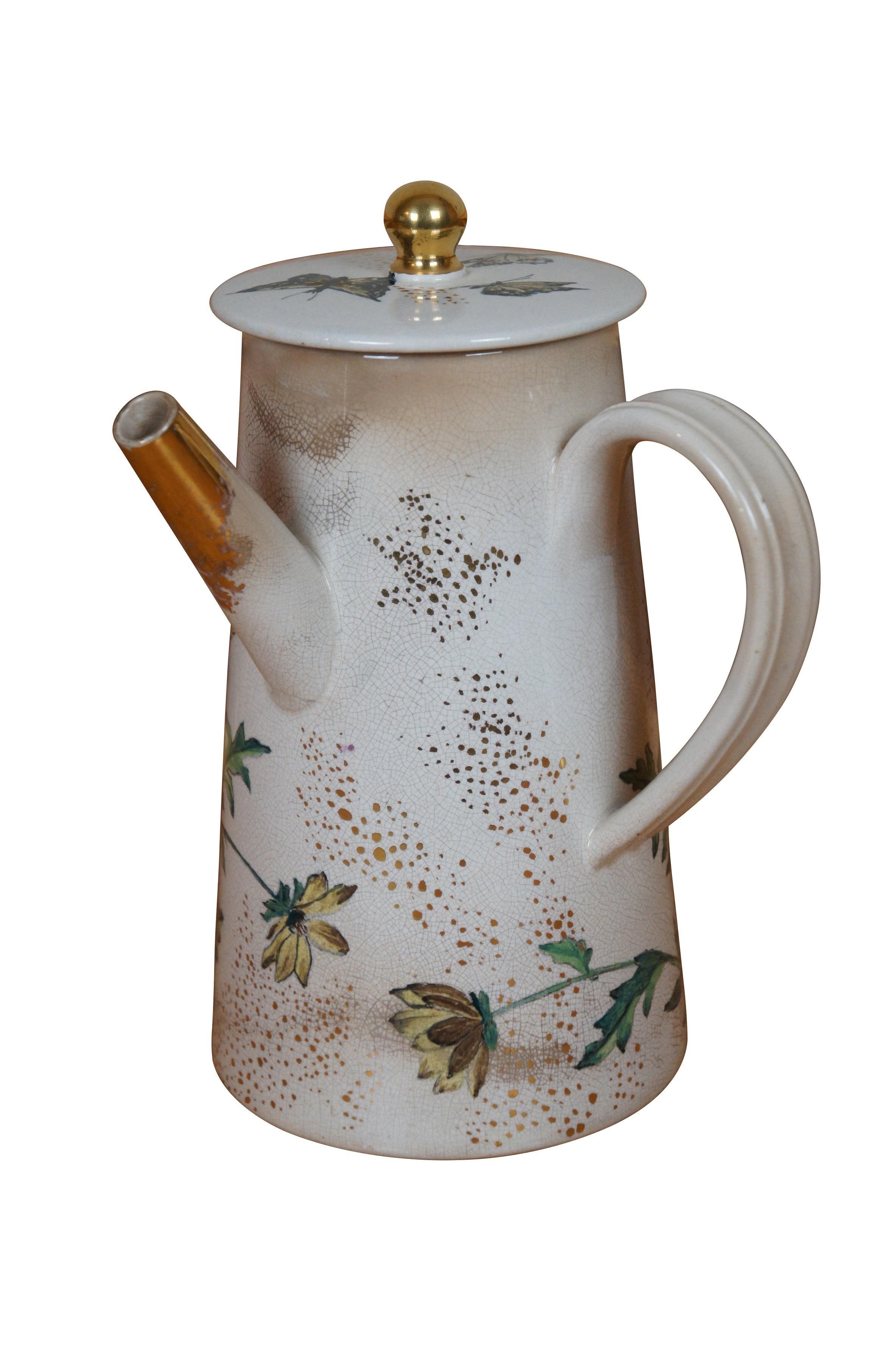 Rare antique early 1881 Rookwood chocolate pot / teapot / coffee pot or pitcher featuring a floral and butterfly motif with lid and handle.  Accompanying paperwork attributes this pitcher to E.P. Cranch, however, the initials do appear to read LPG