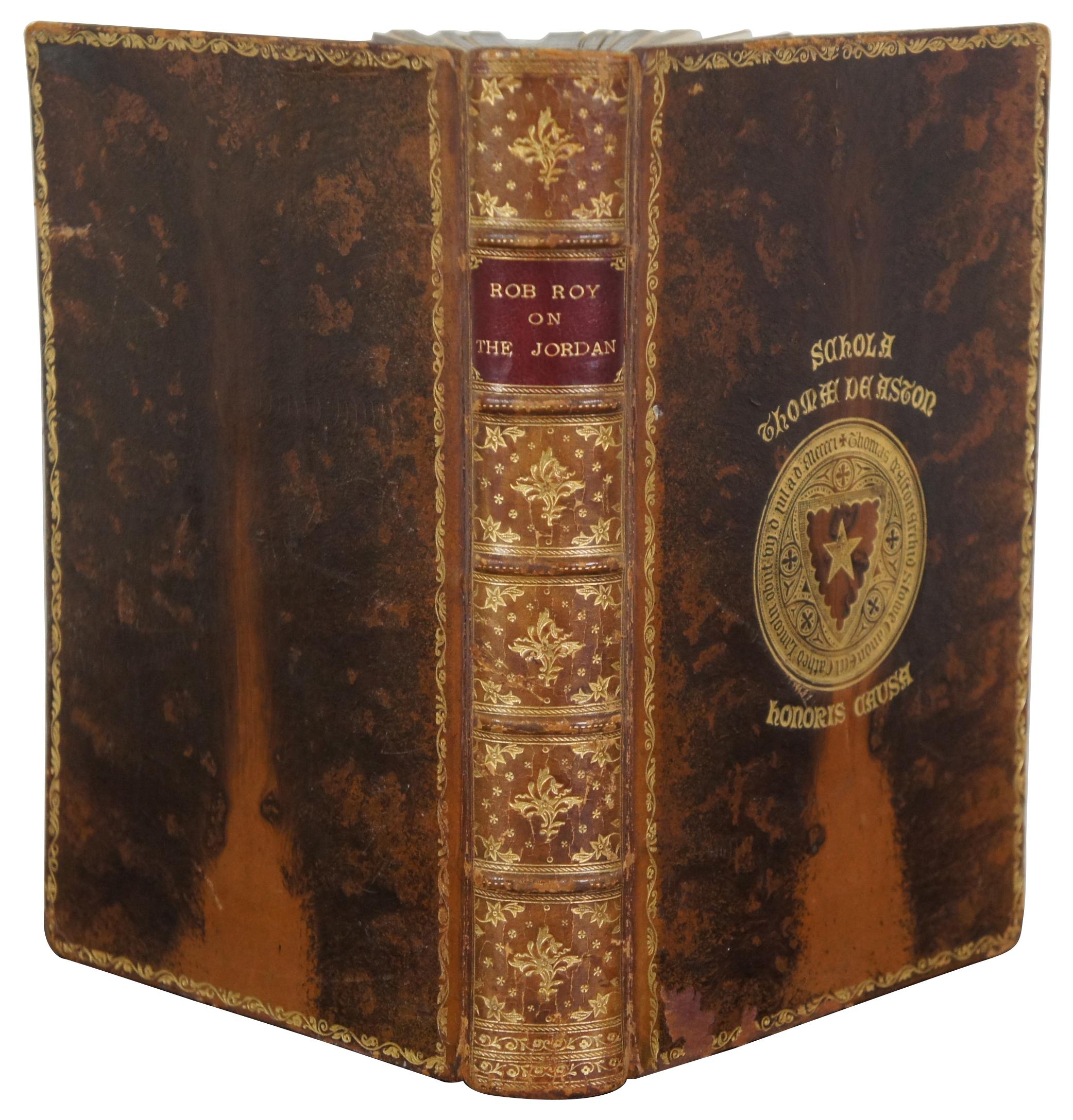 Antique leather bound copy of “The Rob Roy on the Jordan” by J. Macgregor, Seventh Edition with maps and illustrations, published by John Murray, London in 1886, printed by Hazell, Watson, & Viney Ltd, London. Presented in 1895 as an academic prize