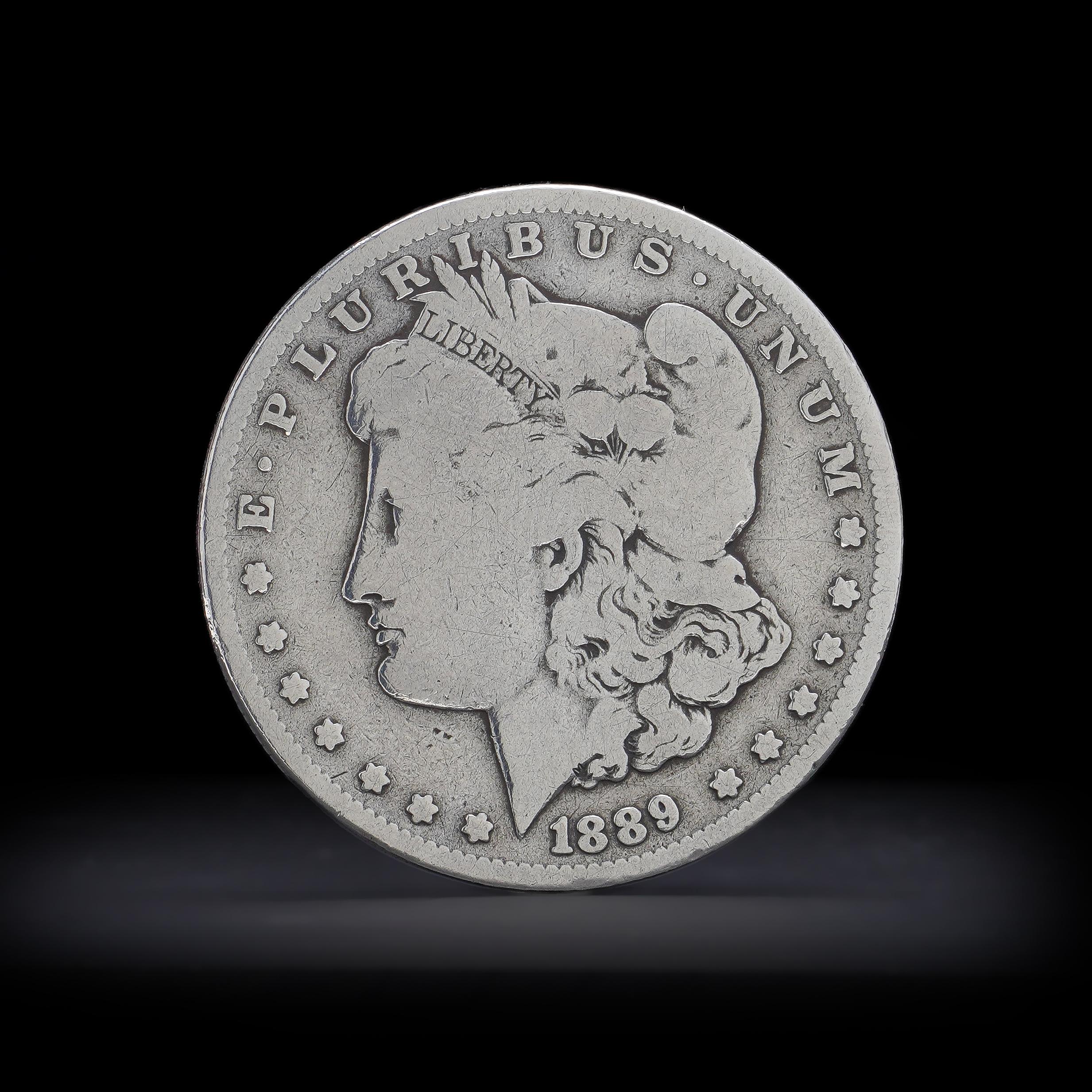 Antique 1889 O Morgan dollar.
Silver fineness: 900/1000
Made in USA, 1889
Mint: New Orleans
Comes with a silver purity certificate.  

1878 is the first year of the popular Morgan dollar series. 

The Morgan Dollar is one of the most famous coins in