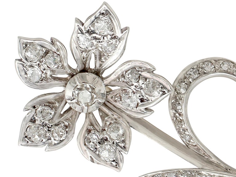 An impressive antique Victorian 1.89 carat diamond and 9 karat yellow gold, silver set floral brooch; part of our diverse antique jewelry and estate jewelry collections.

This fine and impressive Victorian diamond brooch has been crafted in 9k