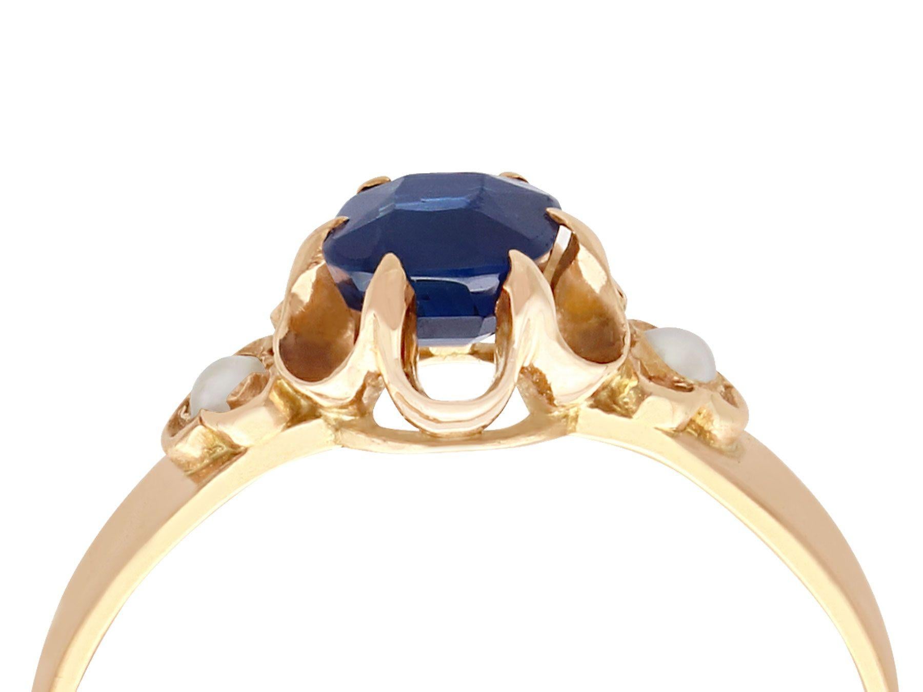 A fine and impressive 1.09 carat blue sapphire and seed pearl, 18 karat yellow gold dress ring; part of our diverse antique jewelry and estate jewelry collections.

This fine and impressive blue sapphire and pearl ring has been crafted in 18k yellow