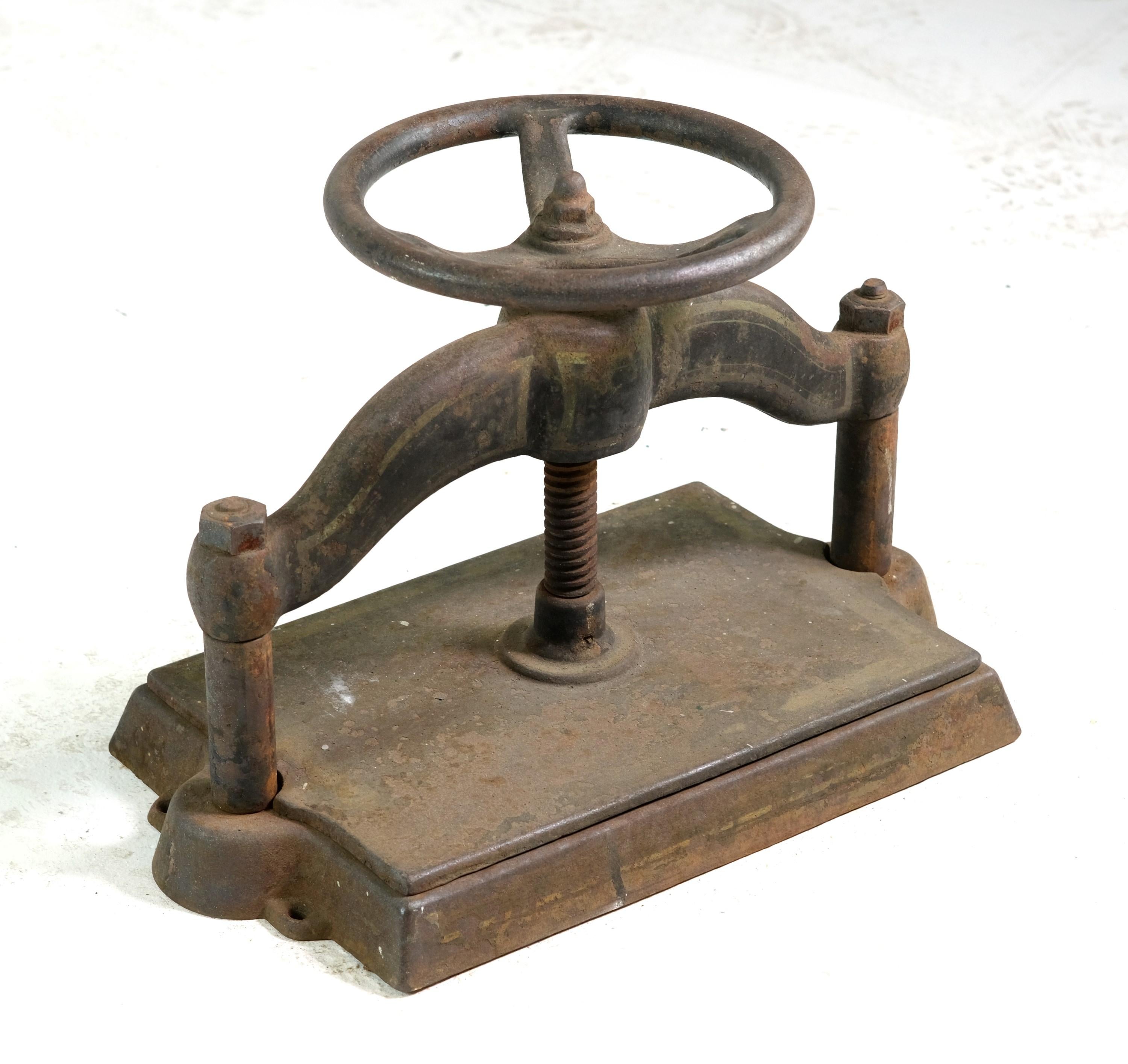19th century antique Industrial cast iron book binding press. The handle spins well and the press up and down. Original patina. Please note, this item is located in our Scranton, PA location.