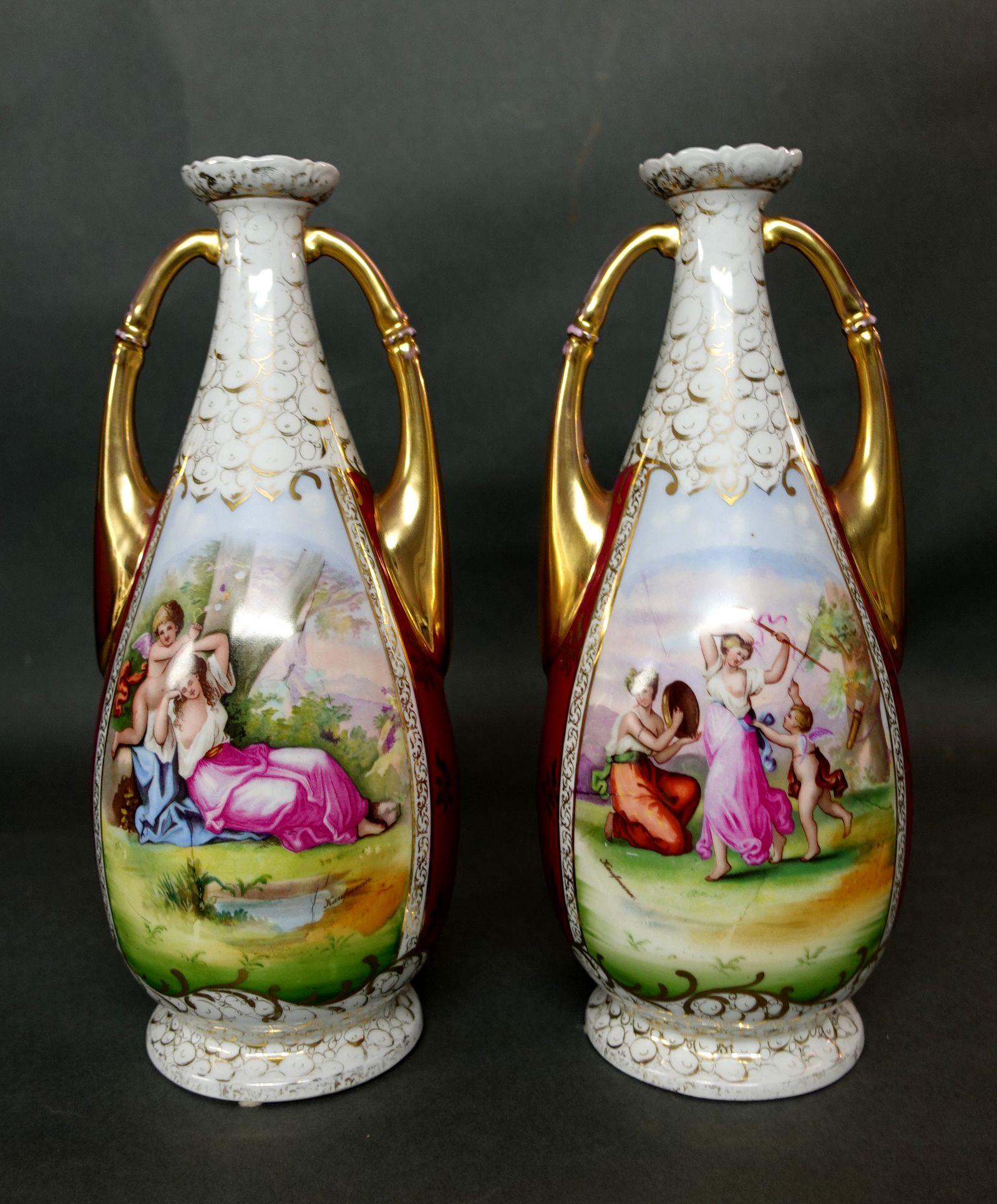Comprising a pair of matching vases with amorous scenes and gilt handles. Two large paintings on each vase and a total of 4 paintings. Measure: Height 14 inches.
  