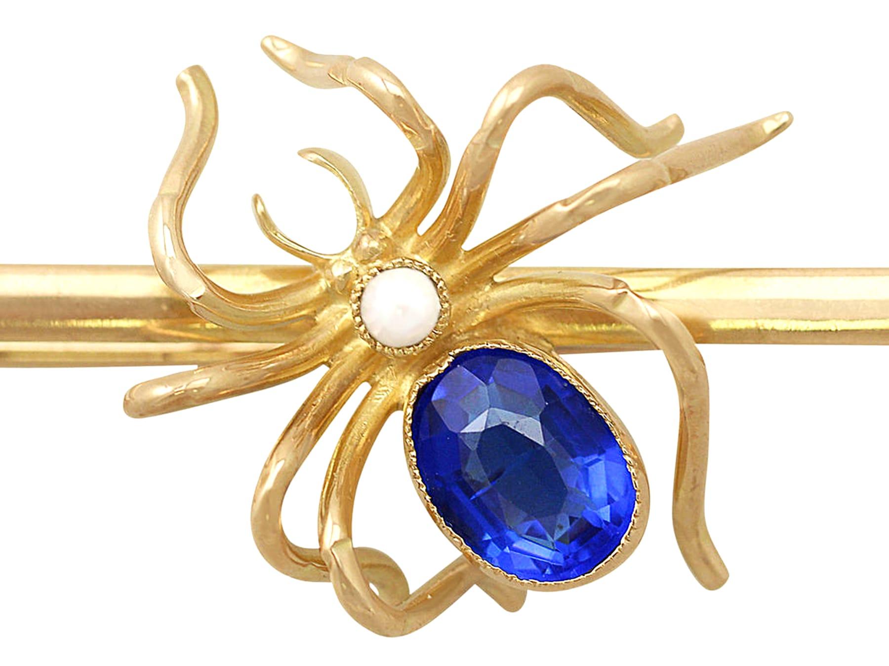 Oval Cut Antique 1890s Pearl and Blue Colored Glass Yellow Gold Spider Brooch For Sale