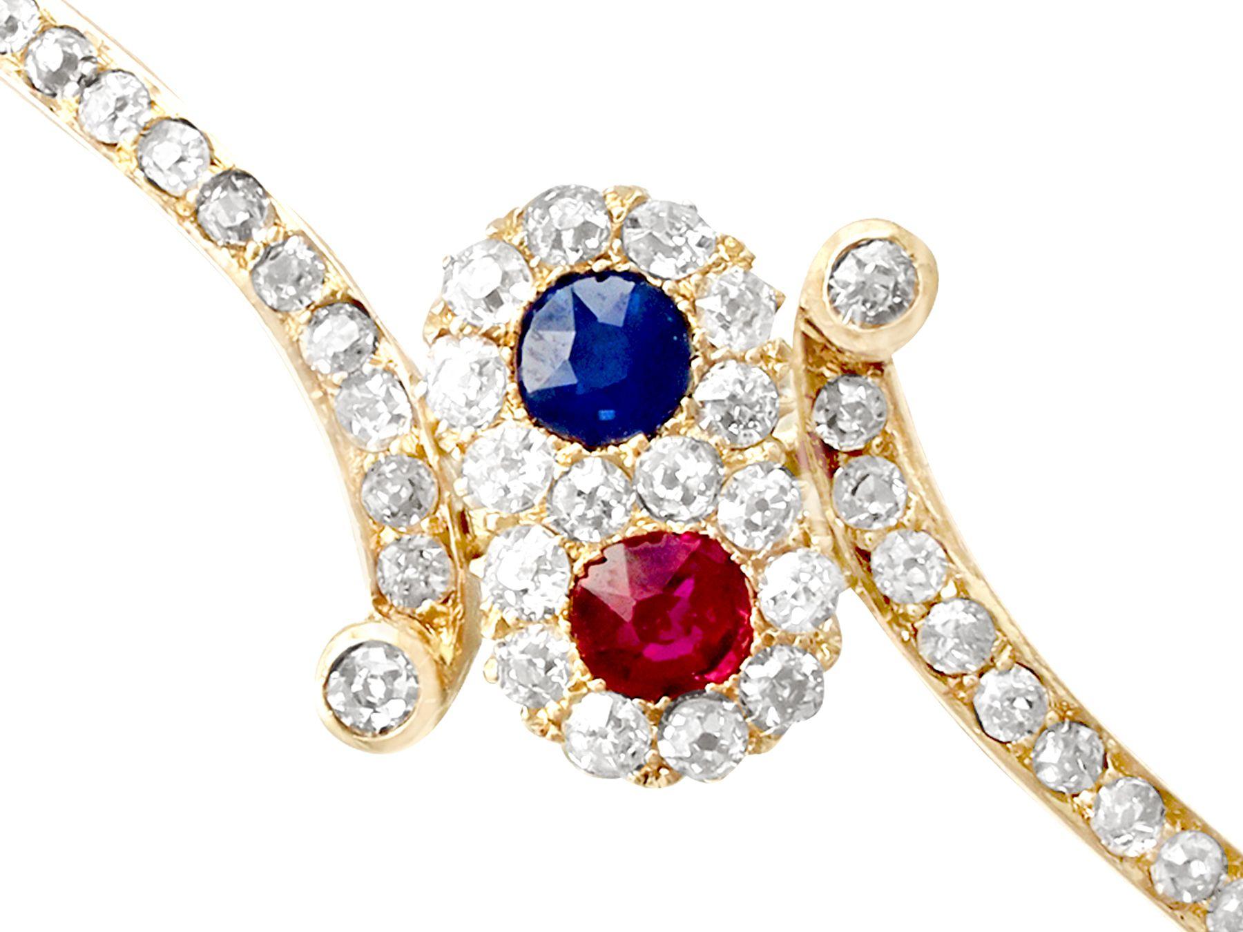 Round Cut Antique 1890s Ruby and Sapphire 1.50 Carat Diamond and Yellow Gold Bangle For Sale
