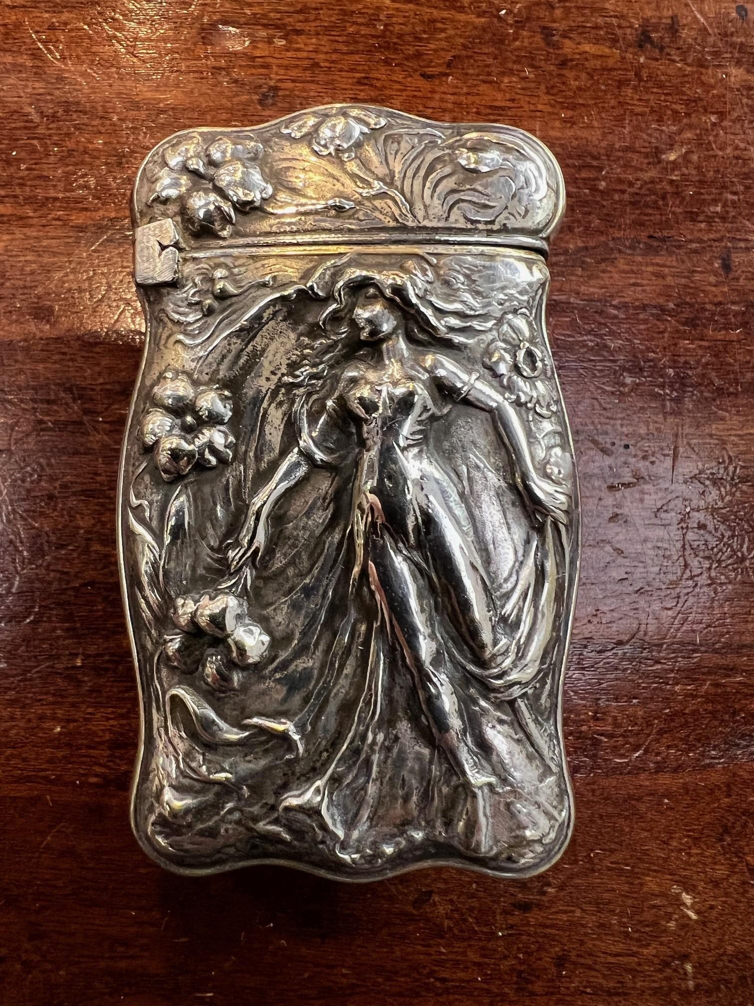 Antique 1890s Silver Art Nouveau Lady with flowing hair repousse match safe. The other side has beautiful, art nouveau style flowers. Shown in the photos its marked C SILVER which I believe is Coin Silver. This is a very nice piece in very good