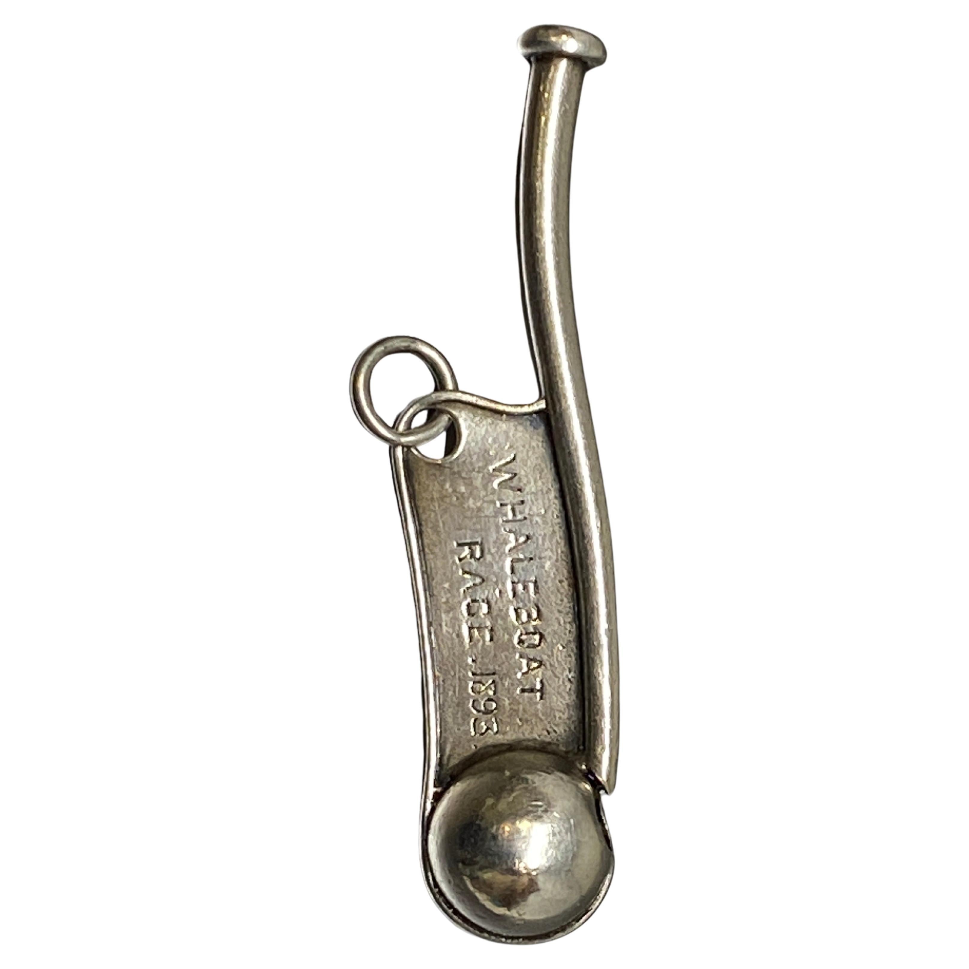 Up for your consideration is this sterling silver gold bosun call or boatswain whistle made by Tiffany & Co.

A bosun or boatswain ranks as the top position or petty officer on the deck of a boat and these whistles were used to communicate to other