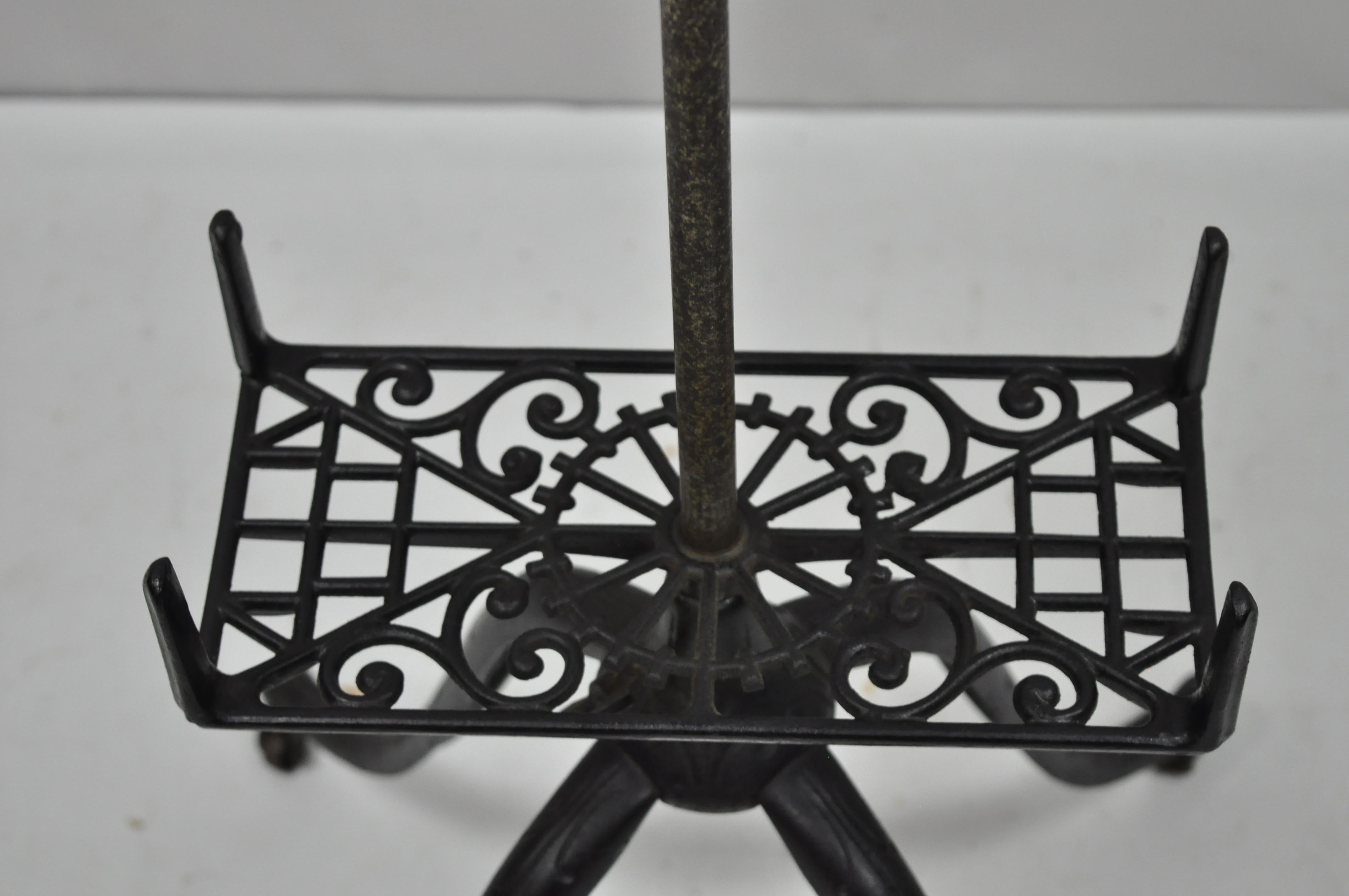antique cast iron book stand