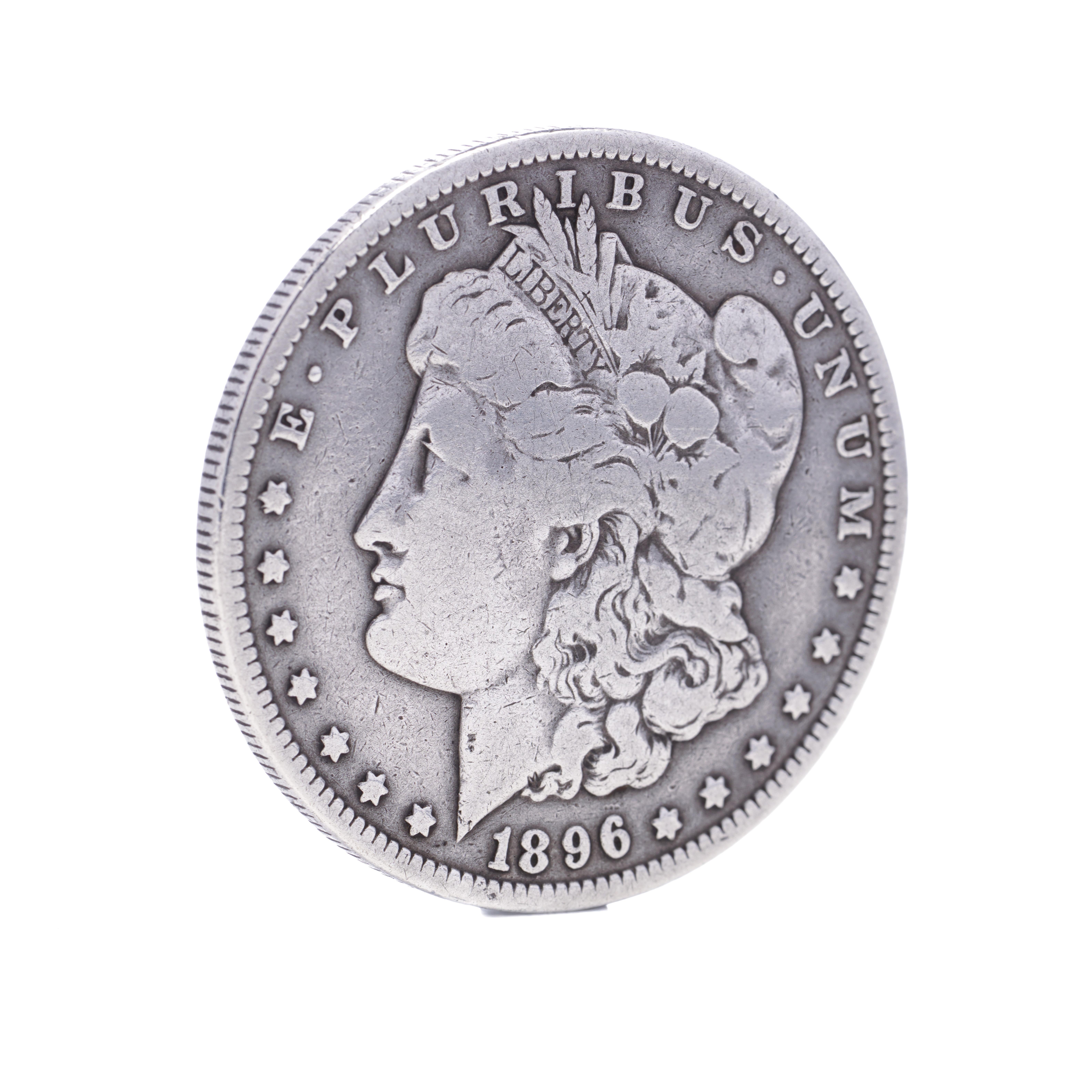 Antique 1896 Morgan dollar
Silver fineness: 900 
Made in USA, 1896
New Orleans mint. 

1878 is the first year of the popular Morgan dollar series. 

The Morgan Dollar is one of the most famous coins in American history. It evokes images of the Wild