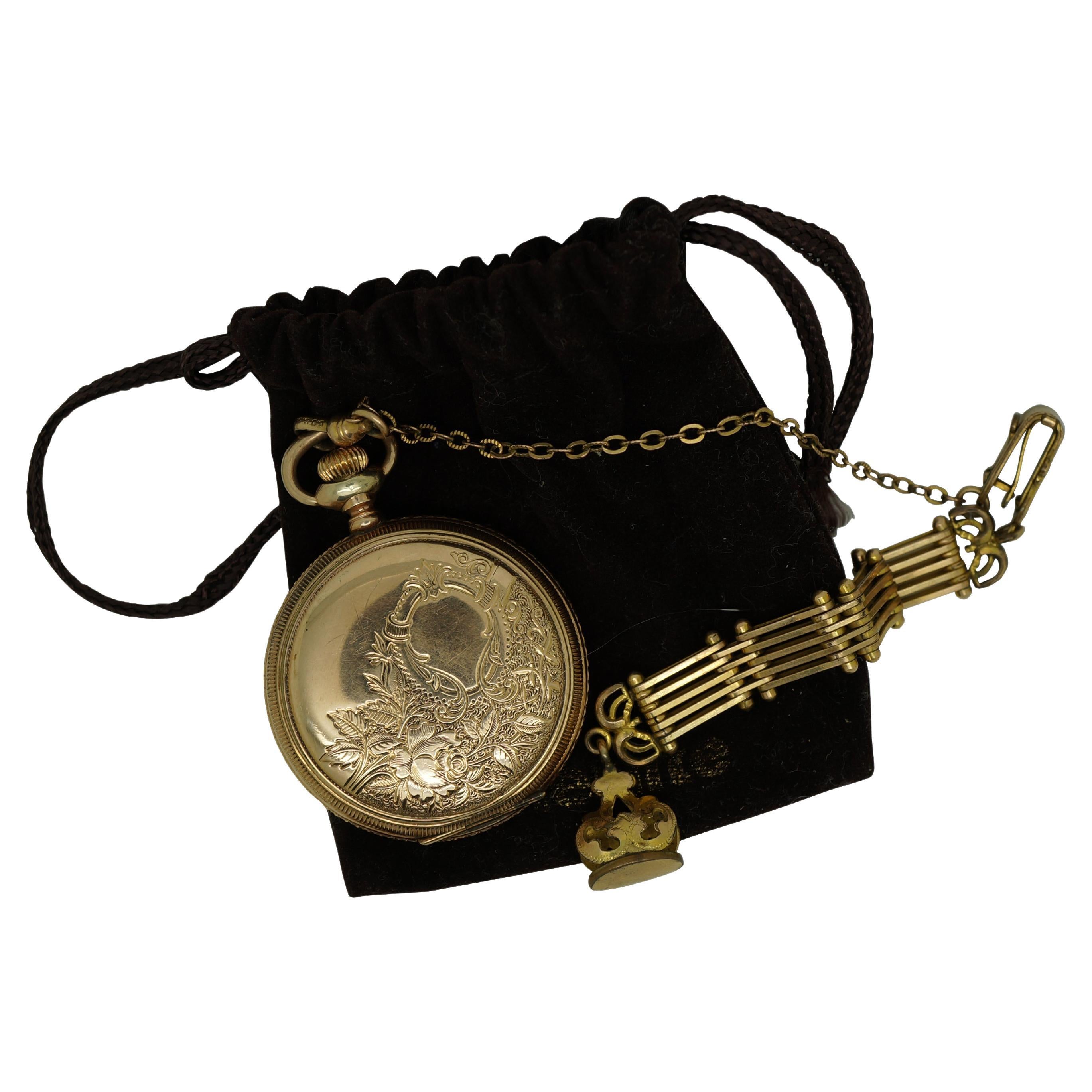 Antique 1897 Waltham hunting style gold pocket  watch. Movement - American Waltham Watch Company - Safety Barrel - 8119314 - Grade Seaside - Model 1890 - 6s - 7 jewels. White face with black Roman numerals, auxiliary dial with Arabic numerals, and