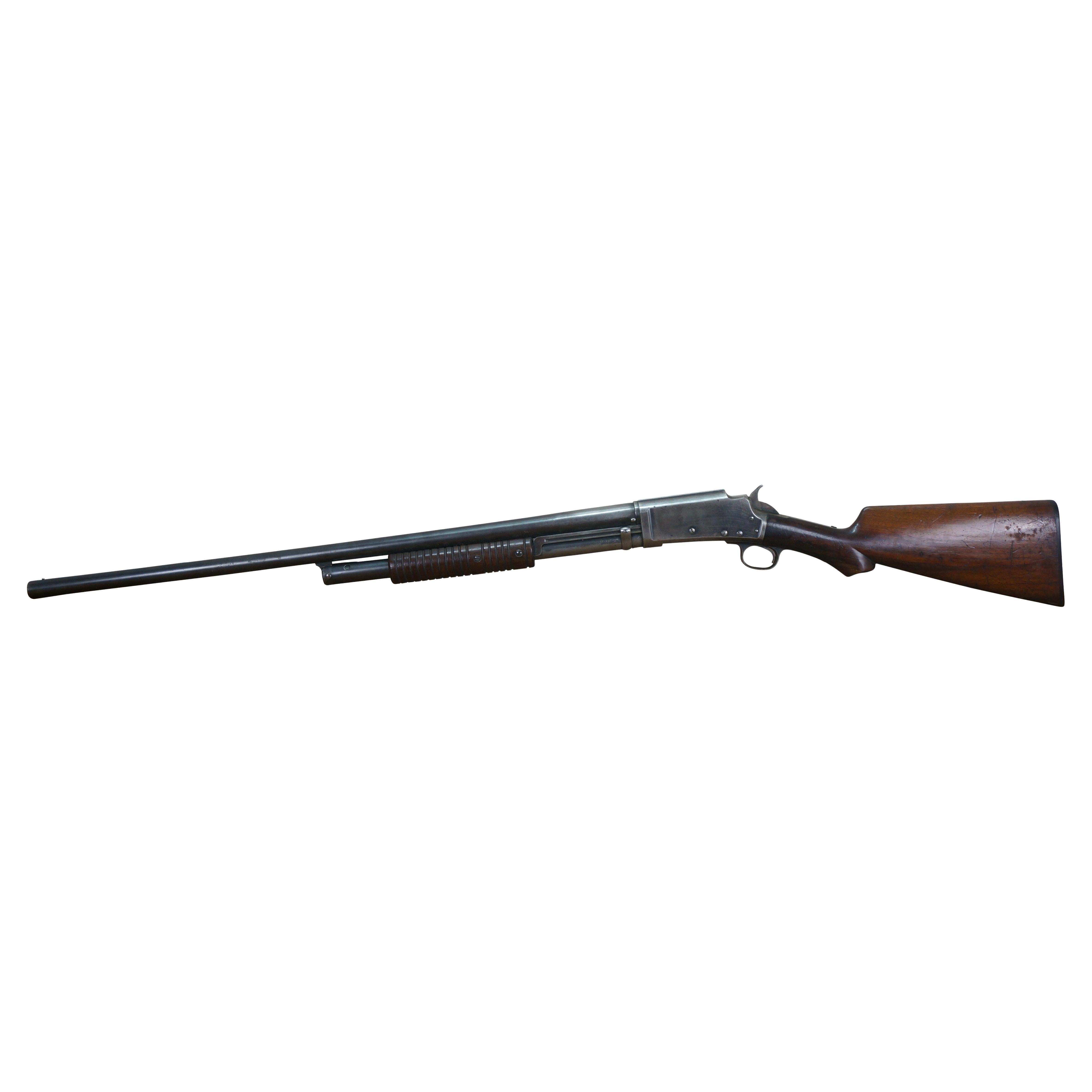 Late 19th century Marlin Firearms 12 gauge pump action single barrel shotgun. Plain oak wood stock and pump grip. Exposed hammer. Serial Number 57542. Marked Marlin on buttplate and barrel. Marlin Fire-Arms Co, New Haven, CT. U.S.A. Pat'd Nov. 6