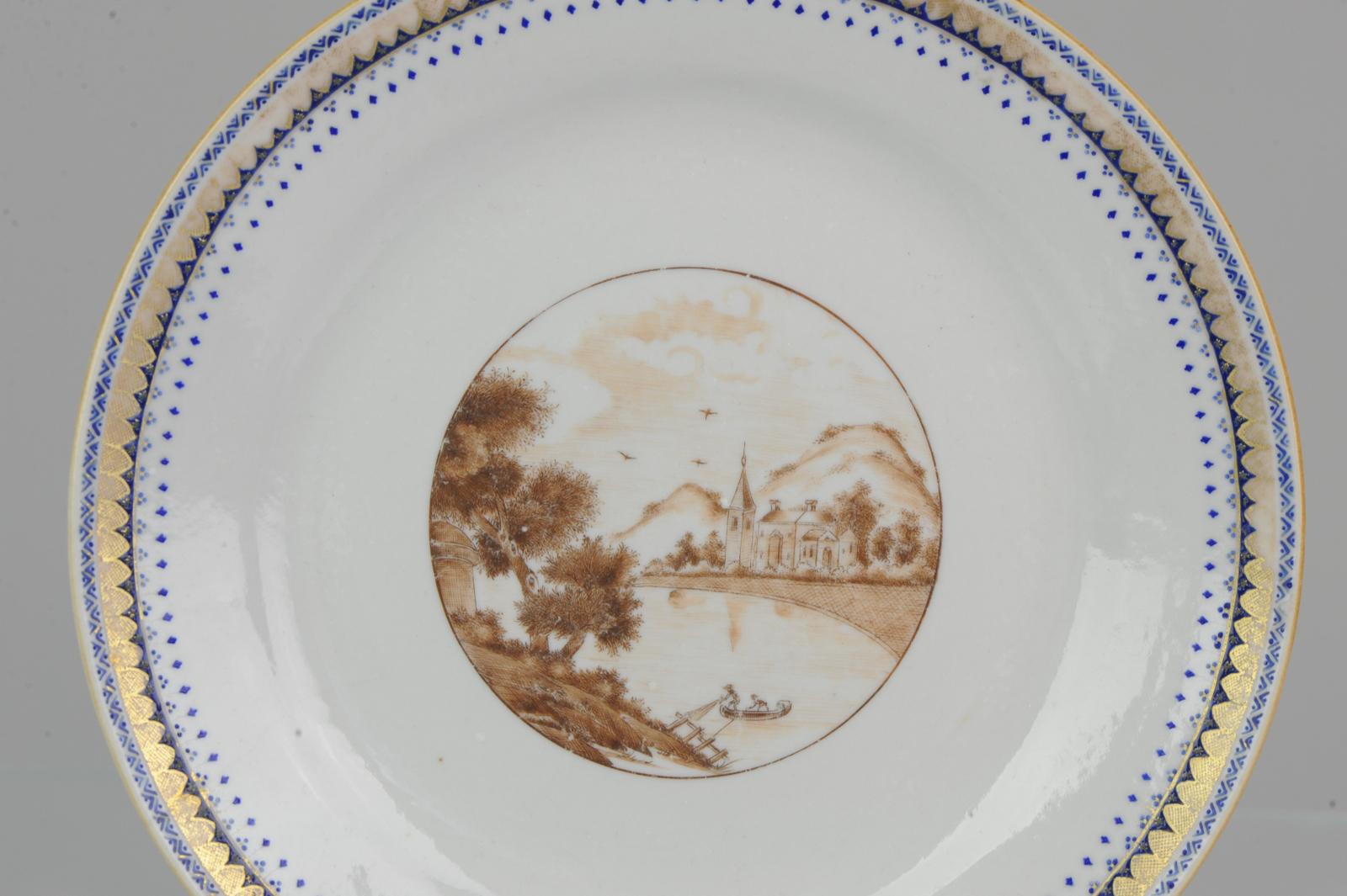 A rare, good conditioned, and quality painted plate.

Very nicely decorated piece with good details. Blue, sepia and gilt decoration, central sepia reserve 