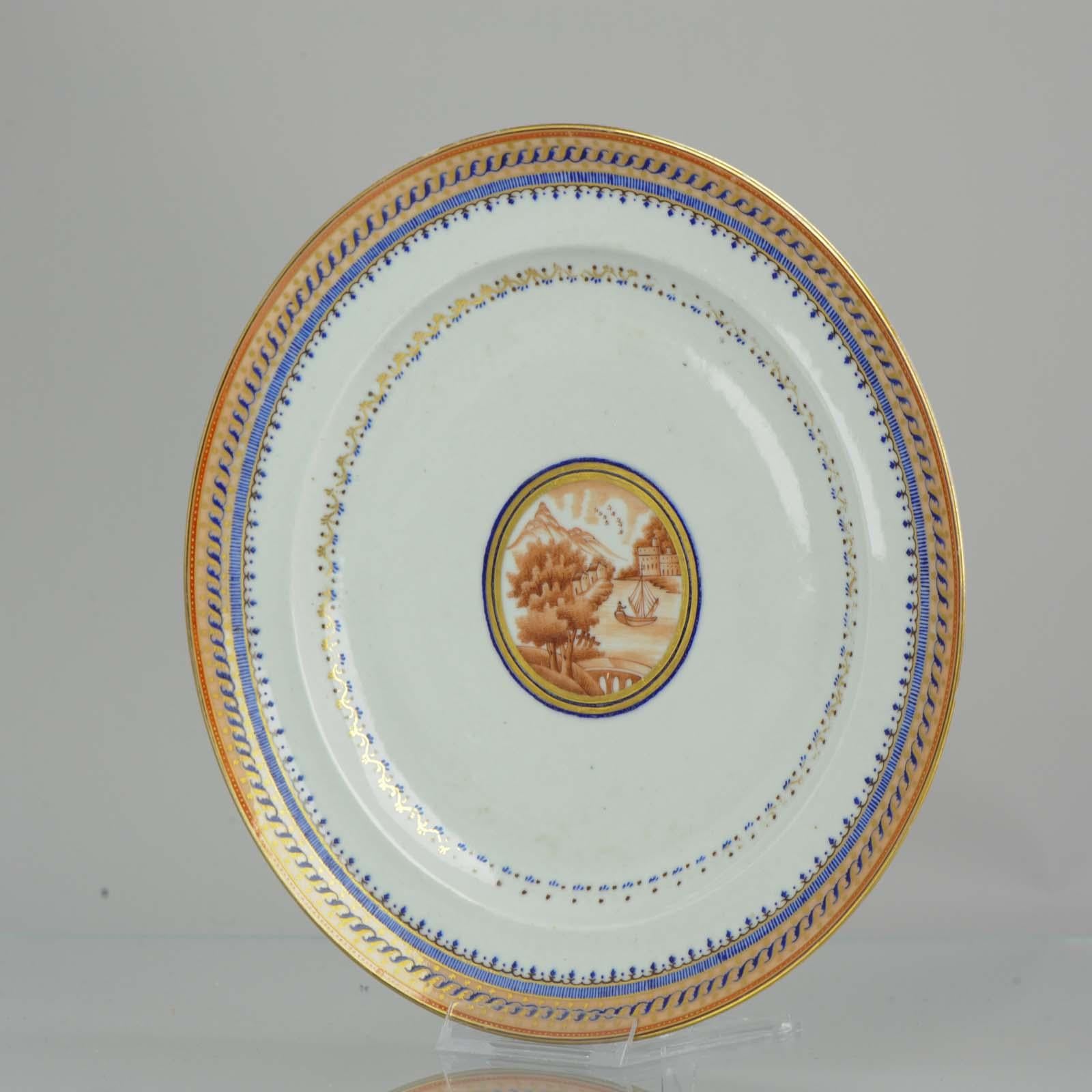 A rare, good conditioned, and quality painting plate.

Very nicely decorated piece with good details. Blue, sepia and gilt decoration, central sepia reserve 