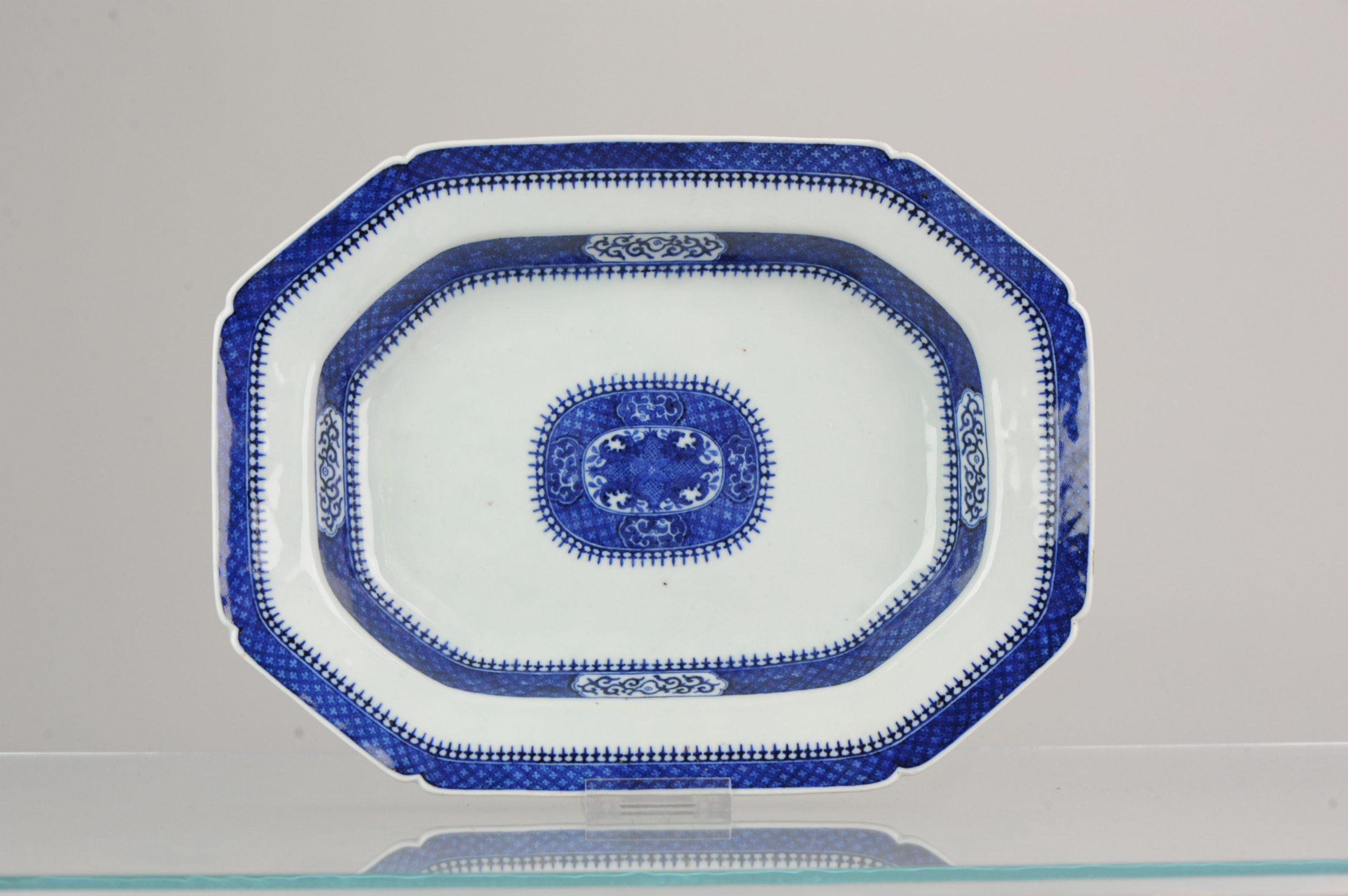 An excellent, deep and large octagonal serving dish, exceptionally finely painted in underglaze blue with central reserve containing four pineapples and foliage, surrounded by a wide diaper border and cartouches containing stylized chilins. Further