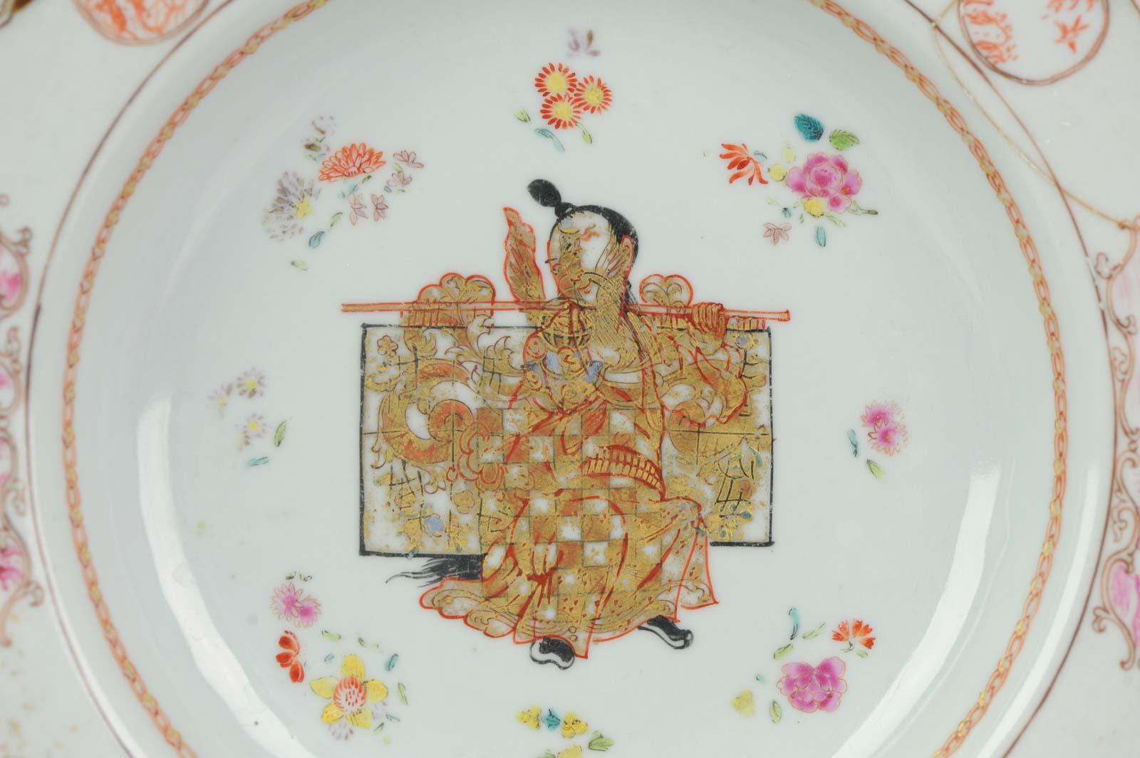 A rare and quality painting plate. It's a chine de commande dish but unusual because the central painting of a Chinese person with a Chinese person holding an artifact with a dragon in gilt. He is also holding a ruyi scepter.

Very nicely