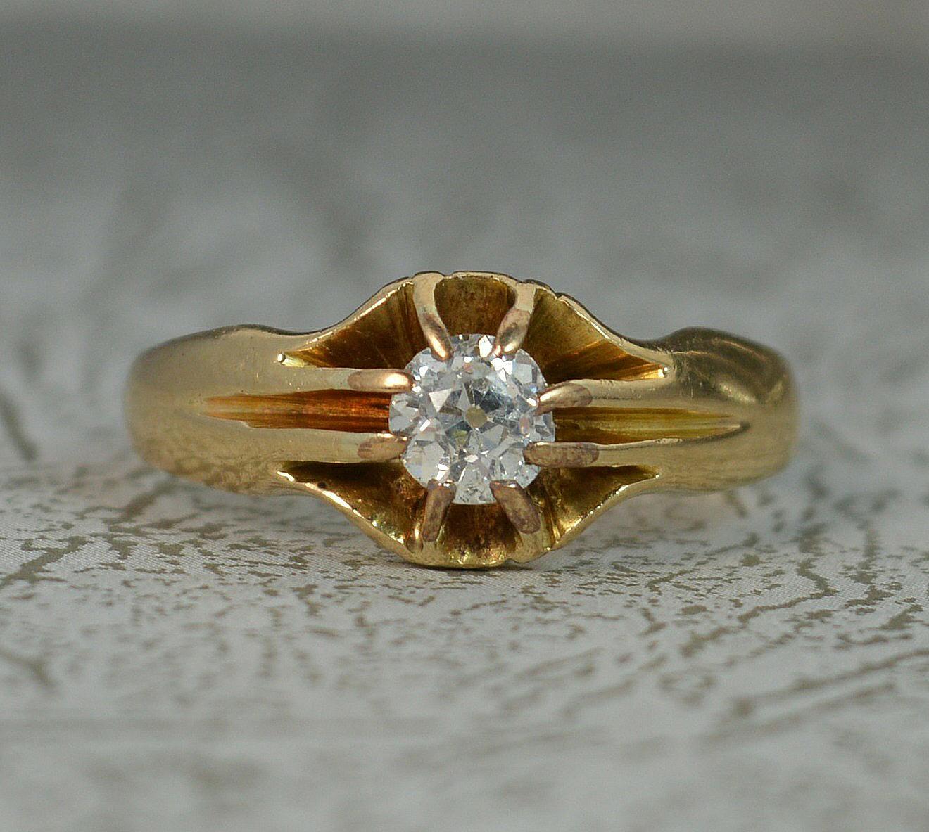 A true antique diamond and 18ct gold solitaire gypsy ring.
Solid 18 carat gold example, English made, set with a single diamond.
Eight claw setting holding a natural old European cut diamond to centre, approx half a carat. 4.85mm diameter.
8.5mm