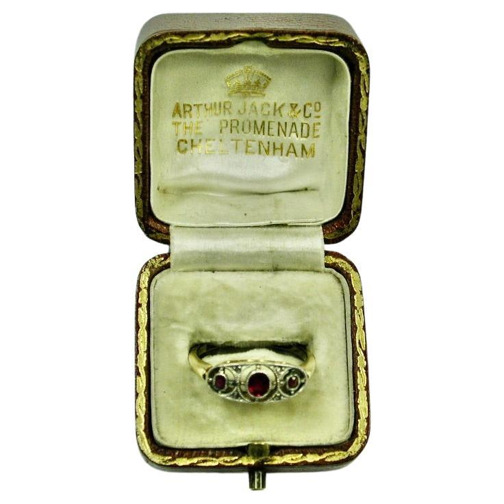 Antique 18ct Gold 3 Stone Ruby Ring with 4 Small Rose Cut Diamonds C 1900.
All the gemstones are set in silver which is typical of this period, before jewellery manufacturers starting using platinum to set stones.
Made by H Williamson Ltd