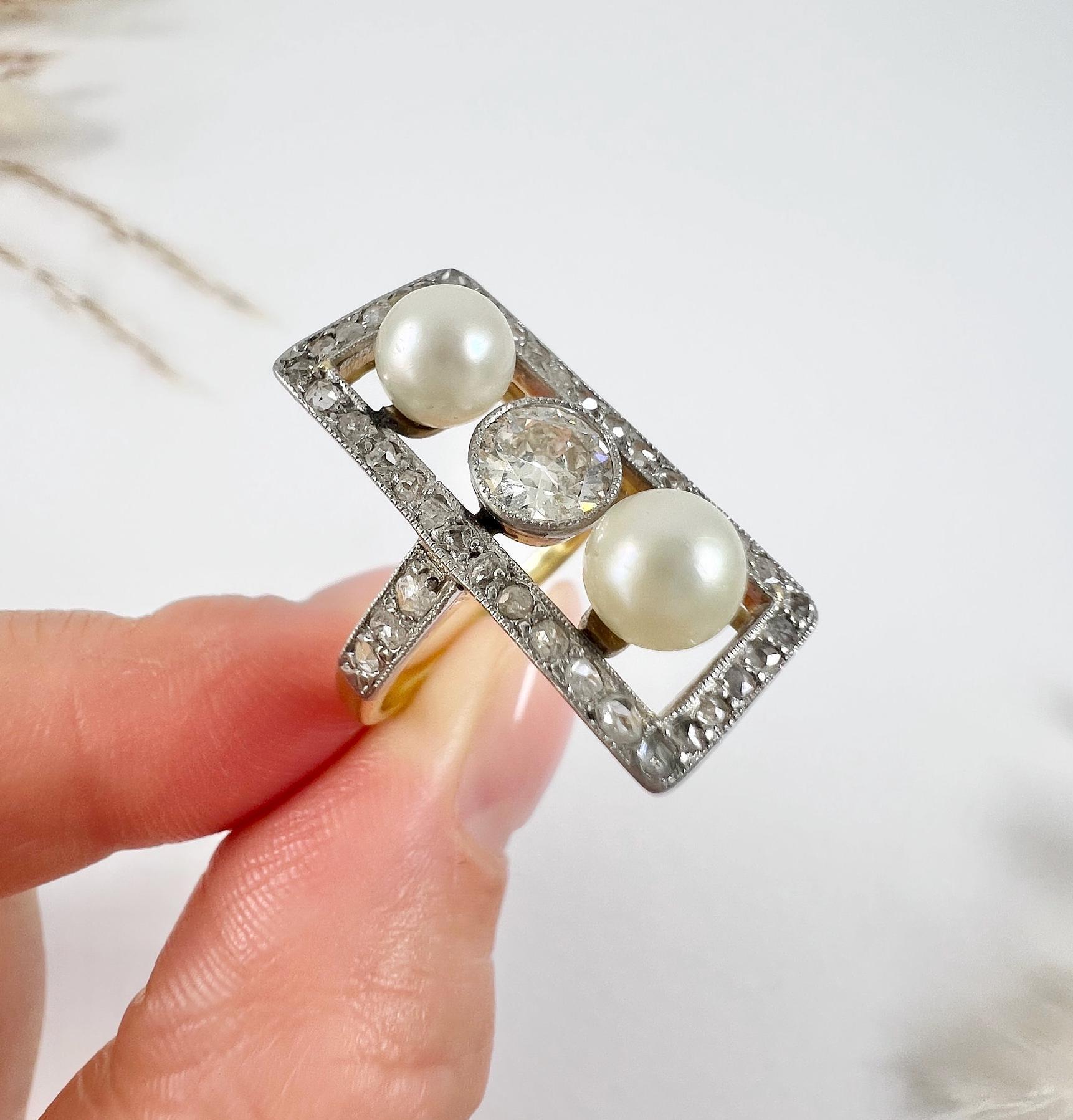 Antique Diamond & Pearl Ring

18ct Gold Tested 

Circa 1910

Introducing a stunning and unique Edwardian ring crafted in 18ct gold. This exquisite ring features a beautiful old-cut diamond weighing 0.70 carats, with an I colour and SI clarity,