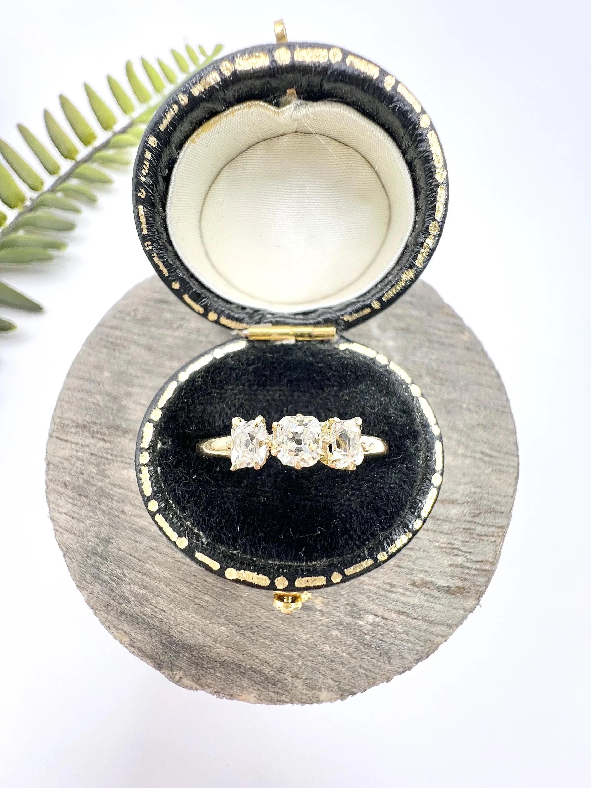 Antique Diamond Ring

18ct Gold

Hallmark Date Letter- h Circa 1903-1907

This exquisite Edwardian trilogy ring is crafted in rich 18ct yellow gold, embodying the elegance and craftsmanship of its era. Set with three slightly differently shaped old