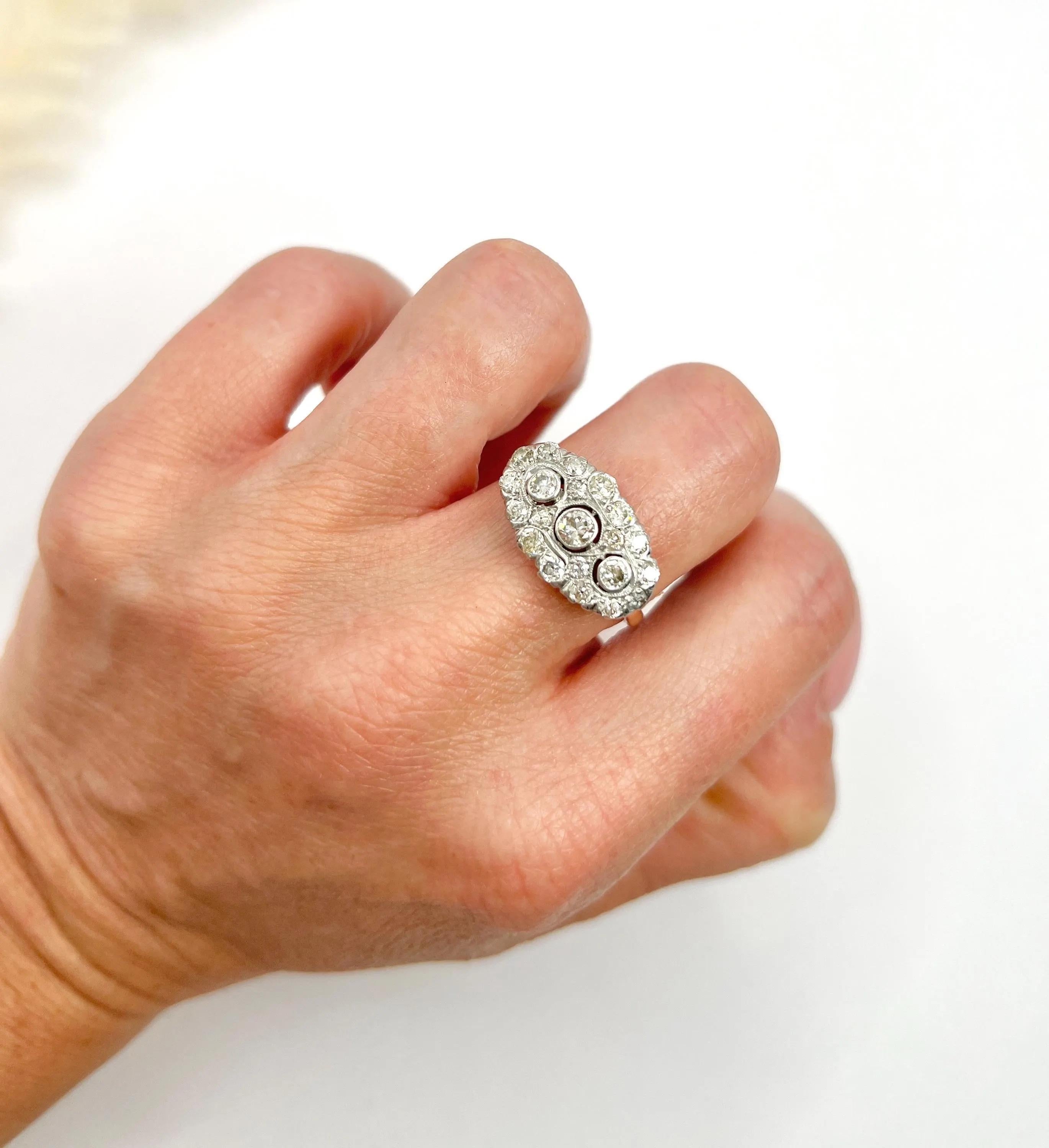 Antique Diamond Ring 

18ct Gold

Circa 1910

Introducing an exquisite 18ct Gold Edwardian Era Diamond Three Stone Cluster Ring, a remarkable piece that epitomises the elegance of early 20th-century jewellery design. This stunning ring features