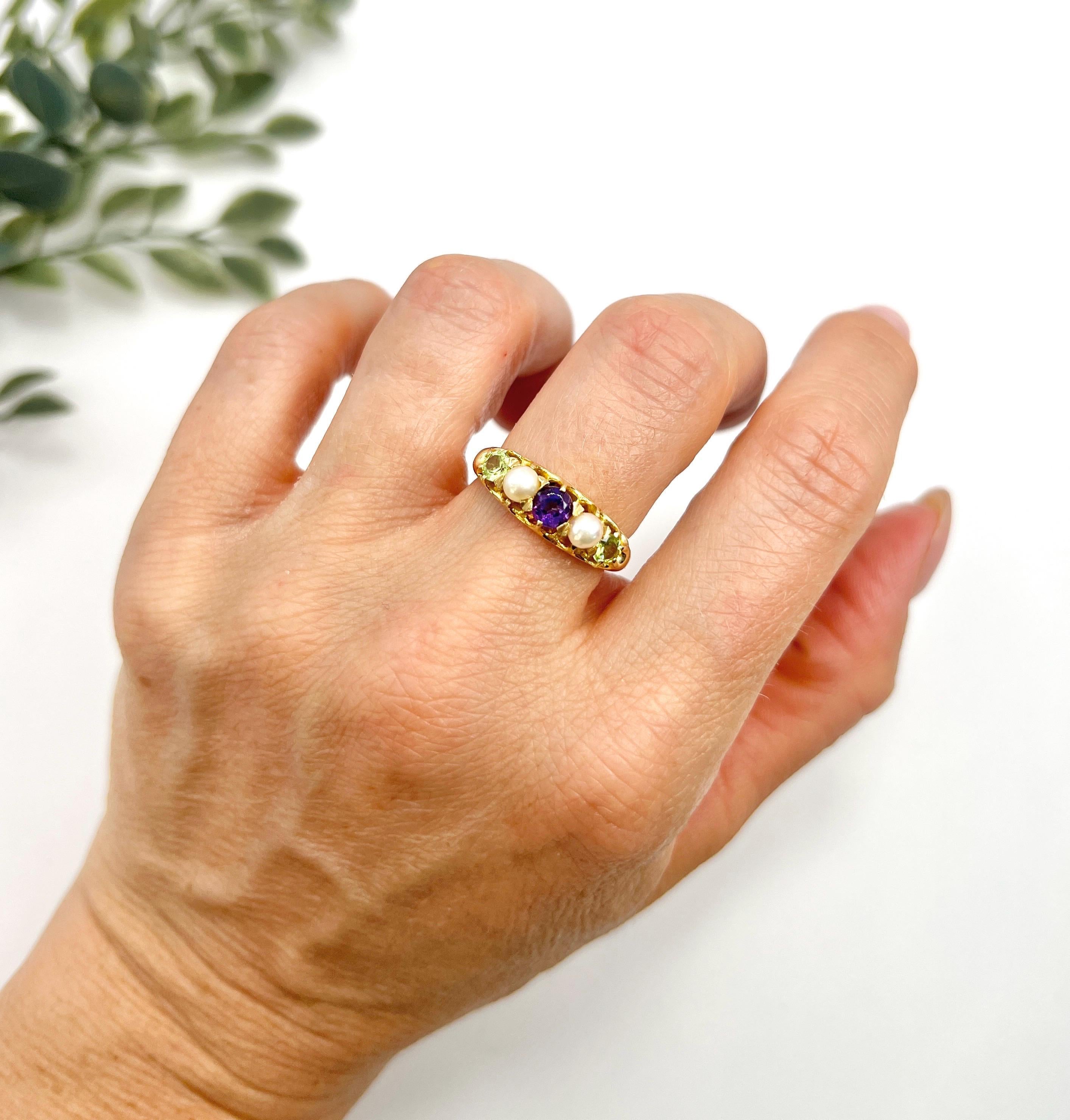 Antique Suffragette Ring

18ct Gold

Circa 1910

This exquisite 18ct yellow gold Edwardian five-stone ring is a true celebration of vintage elegance. Beautifully crafted, it features a stunning arrangement of alternating suffragette colours,
